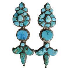Two Turquoise and Silver "Akor" Earrings, Tibet, Early 20th Century