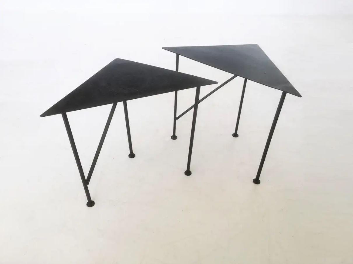 Stylish and practical these one of a kind vintage geometrical side / drink tables offers smart styling. These were completely hand made and have a terrific design! Triangular shaped top supported on a three-foot wrought iron base. In the lower part,