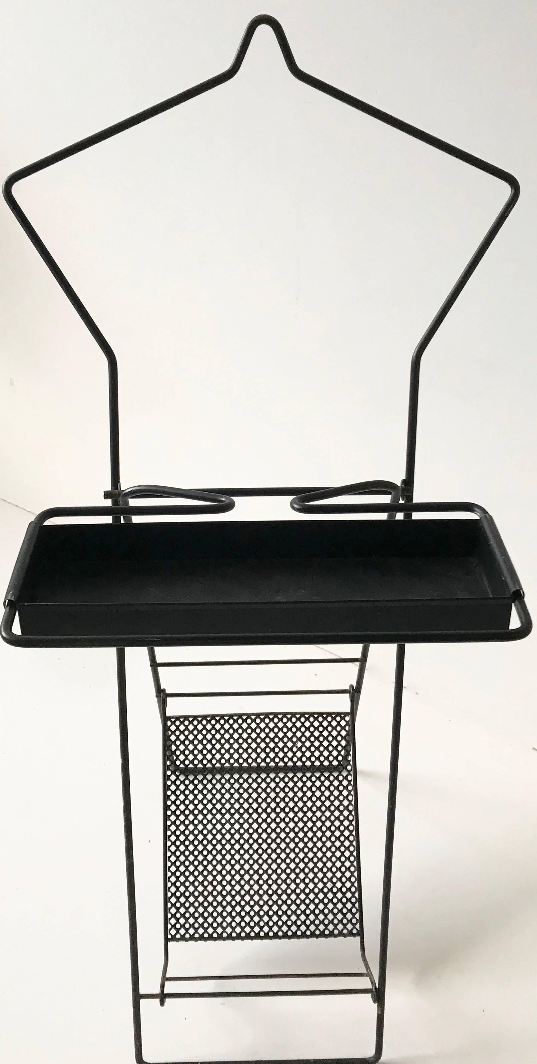Exceptional pair of fold-able valet, coat racks manufactured for Pilastro in the Netherlands between 1955 and 1960. 
Made from enameled metal.
Two valets: one white in the original condition, one black in very good condition.