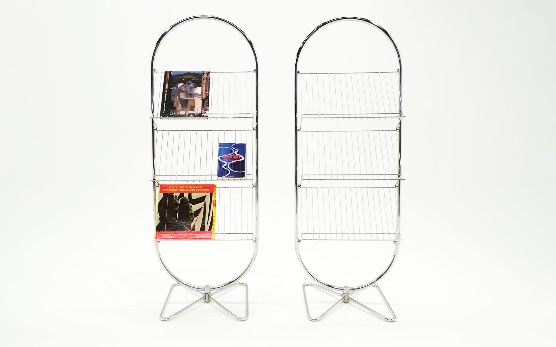 A Pair, but can be purchased separately, of Verner Panton magazine / book / LP Stands.  Chrome plated steel.  Manufactured by Fritz Hansen, Denmark.  Very few if any signs of use.