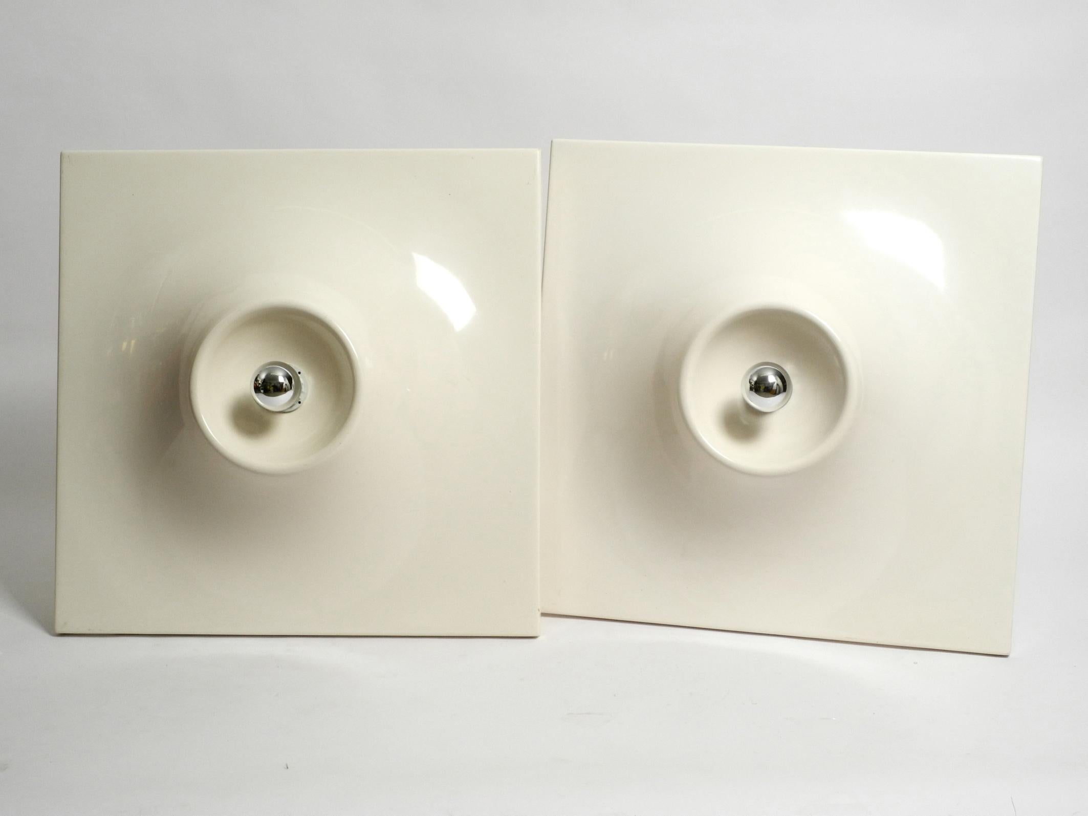 Two very large square 1960s Space Age wall or ceiling lamps.
The lamps are made of polyurethane and are painted in beige white.
Made in Germany. Beautiful Minimalist Space Age design.
With mirrored bulbs it creates a very nice glare-free