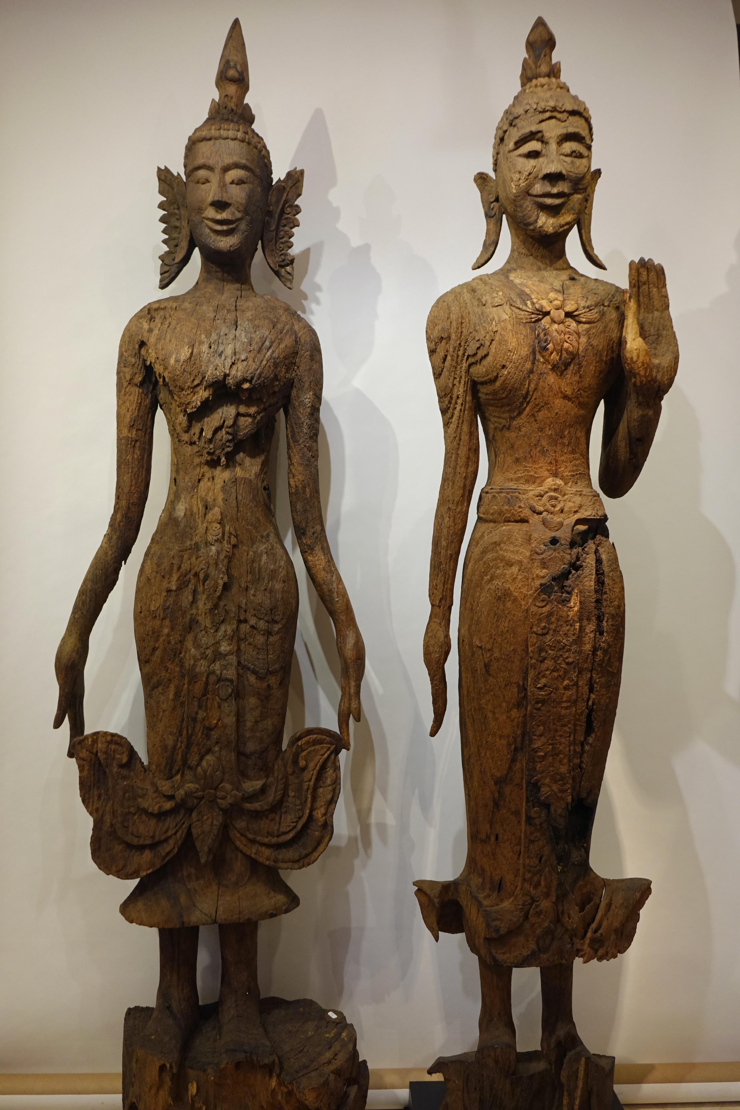 Two very large Buddhas in monoxyl teak wood, Laos, Luang Prabang, 17th-18th century. The one on the right is represented in a gesture of absence of fear, of protection 