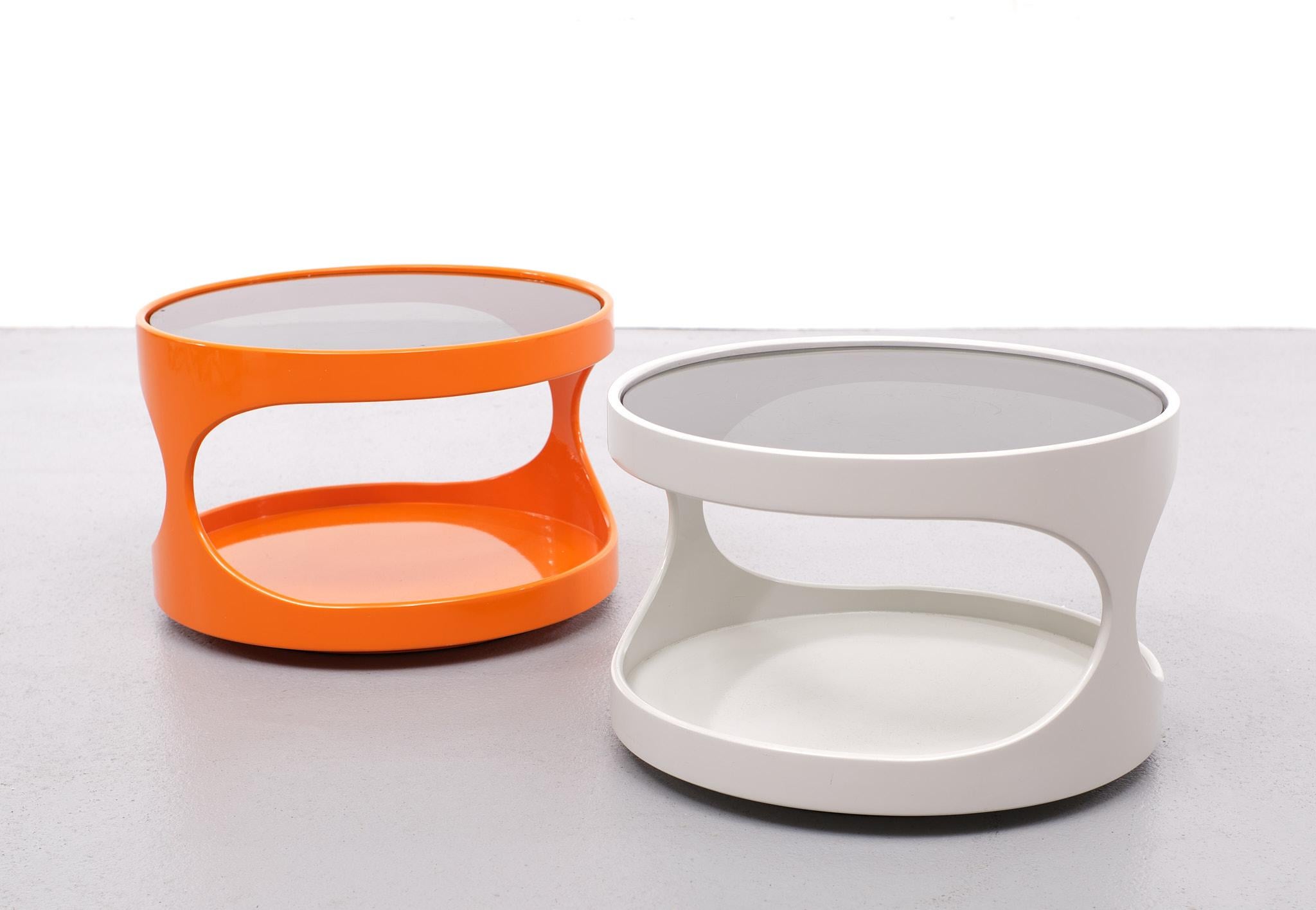 Two very nice Space Ace side tables. Manufactured by Nebu Holland 
Designed by Erik Van Buijtenen 1970s. One in a Bright Orange, and one in 
White. Grey smoked glass tops. These are good quality tables.