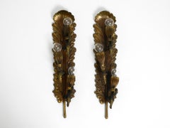 Two very rare original Italian Mid Century heavy brass wall lamps with 3 sockets