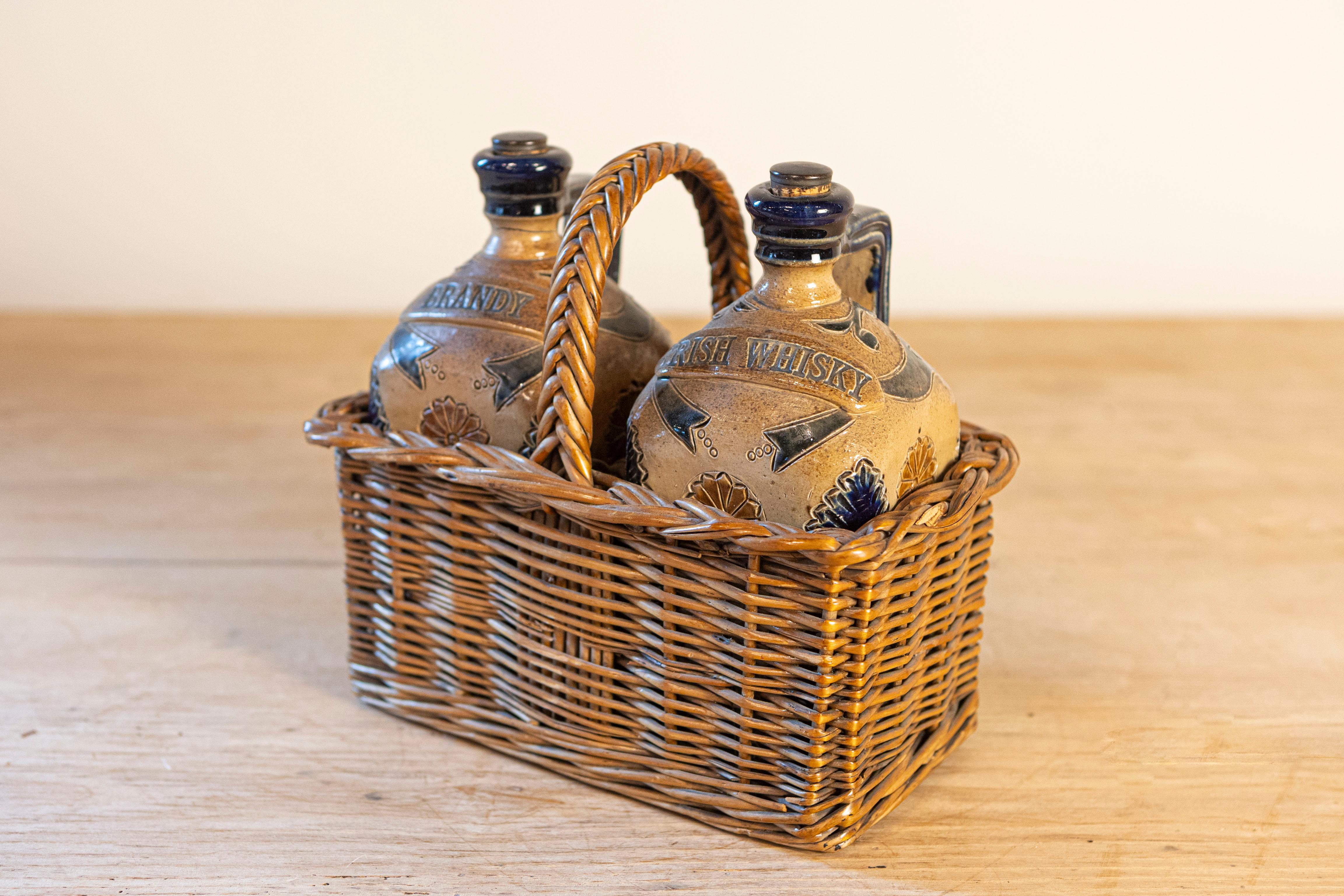 Two Victorian English Pottery Decanters in Tantalus-Inspired Wicker Basket In Good Condition For Sale In Atlanta, GA