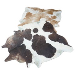 Two Used 1950s Cowhide Rugs