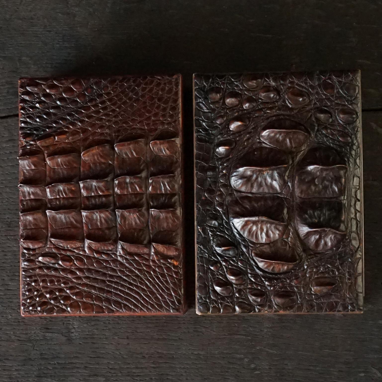 Two very decorative heavy 1960s vintage wood and leather cigar boxes. The boxes are 'coated' outside with leather and pieces of crocodile on top and cork on the bottom (to avoid scratches on your desk or table).
The inside is lined with cedar