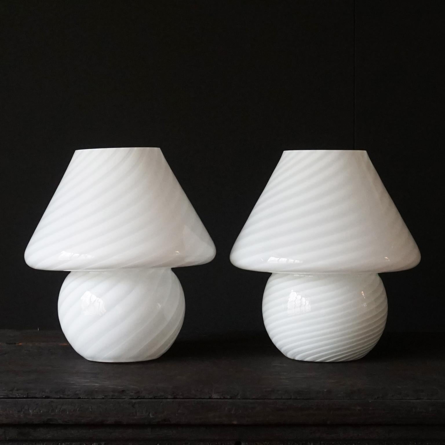 Gorgeous set of two vintage Hollywood Regency style 1970s Vetri Venini Murano white cased swirl art glass mushroom lamp shades 

Made of hand blown frosted cased glass. With opaque white and clear swirls. One still has the original label that says: