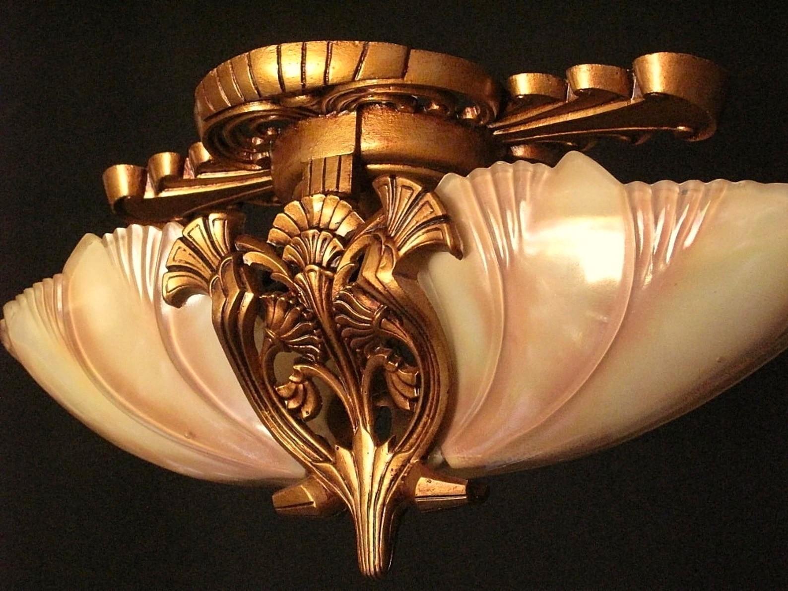 Two available, priced each.
Truly an Art Deco delight. From the height of the American Art Deco movement c.1932 comes this expertly designed and executed flush mount ceiling fixture with all the color and life we have come to love from the deco