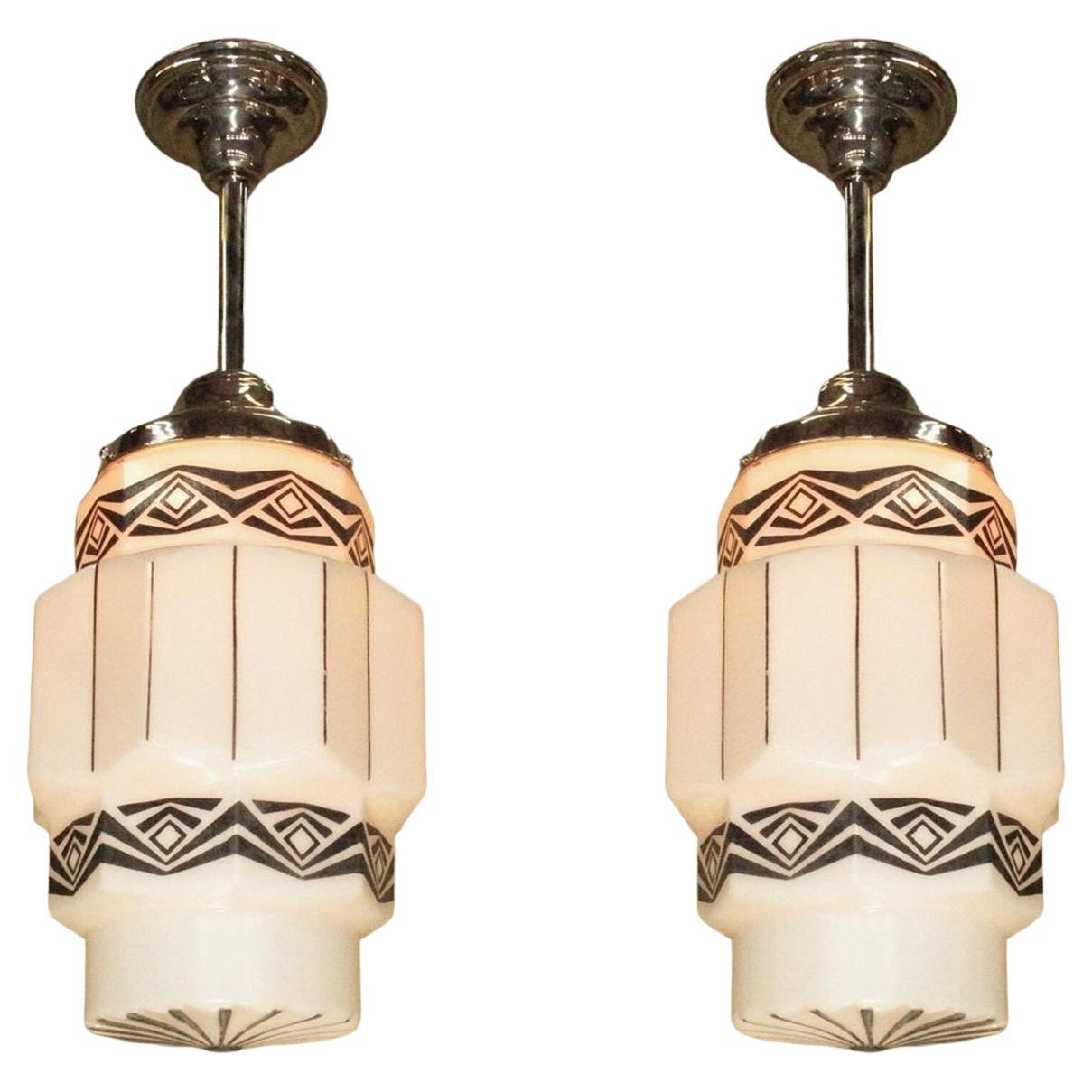 Two Vintage Art Deco Pendants with Black Designs on Milk Glass priced each For Sale