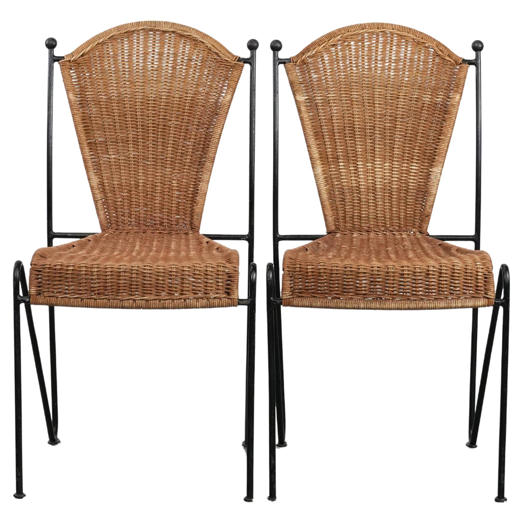 Two vintage design dining chairs by Frederick Weinberg with cast iron frame