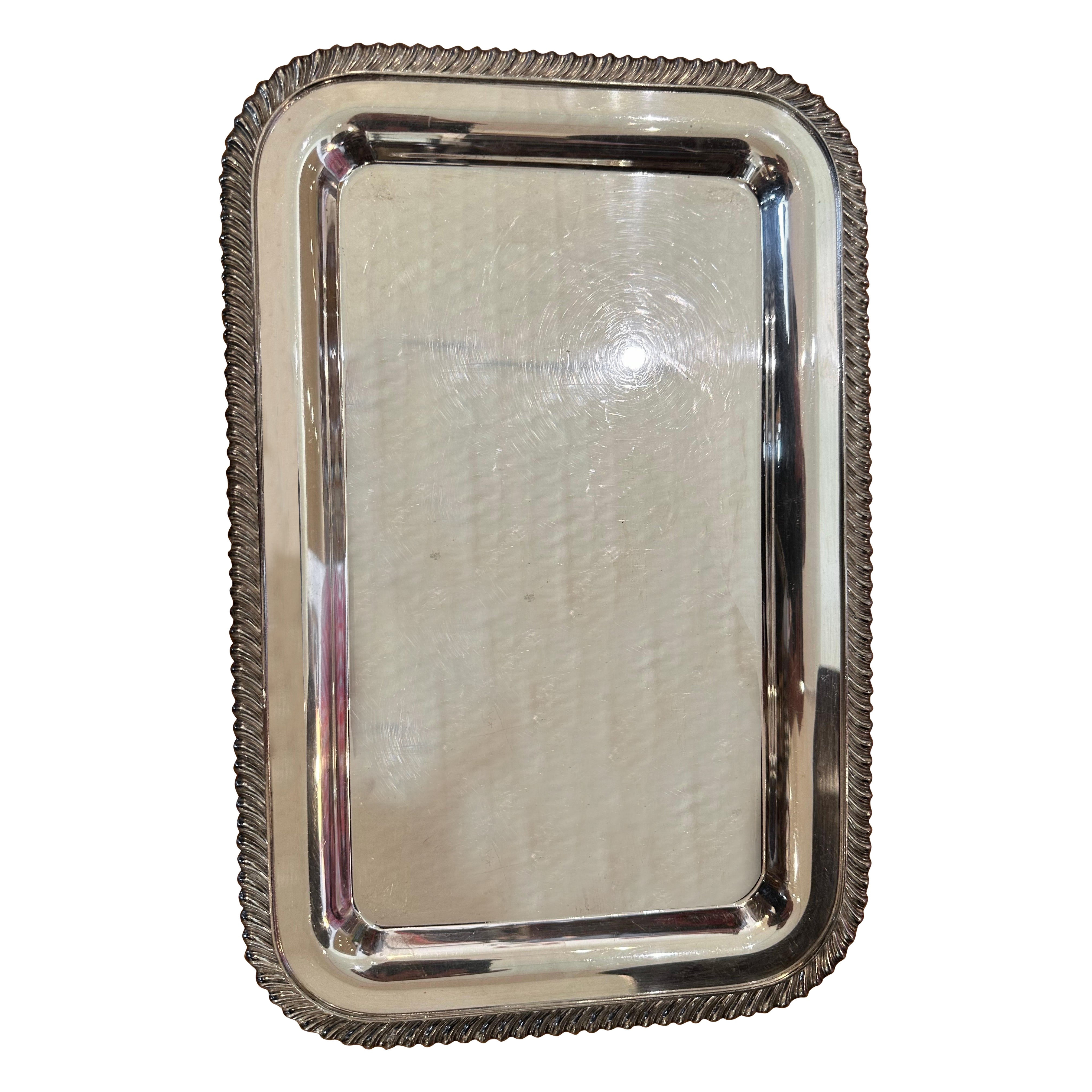 Two vintage George V silver plated trays with gadrooned border and one meat rack