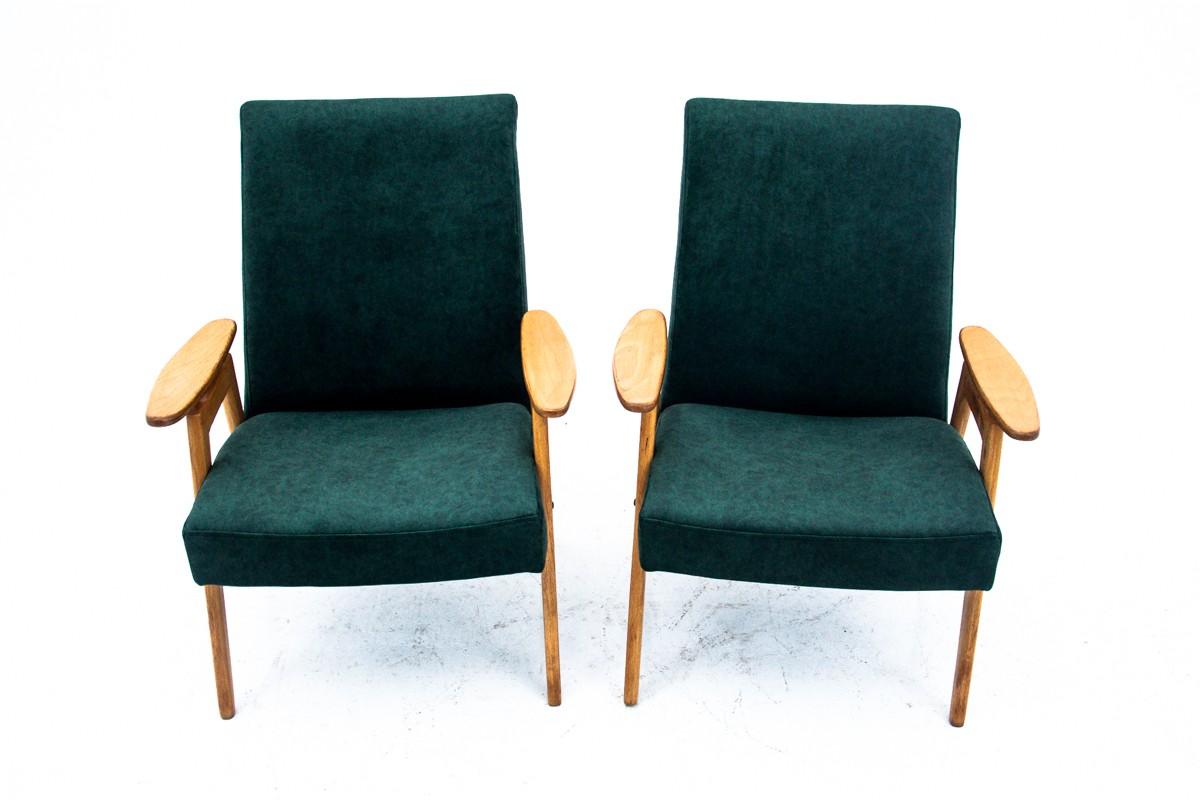 Two iconic vintage armchairs designed by Jaroslav Smidek in former Czechoslovakia in the 1960s.

Very comfortable armchairs with high backrest and delicately profiled armrests.

Frame made of beech wood, upholstery replaced with velvet, dark bottle
