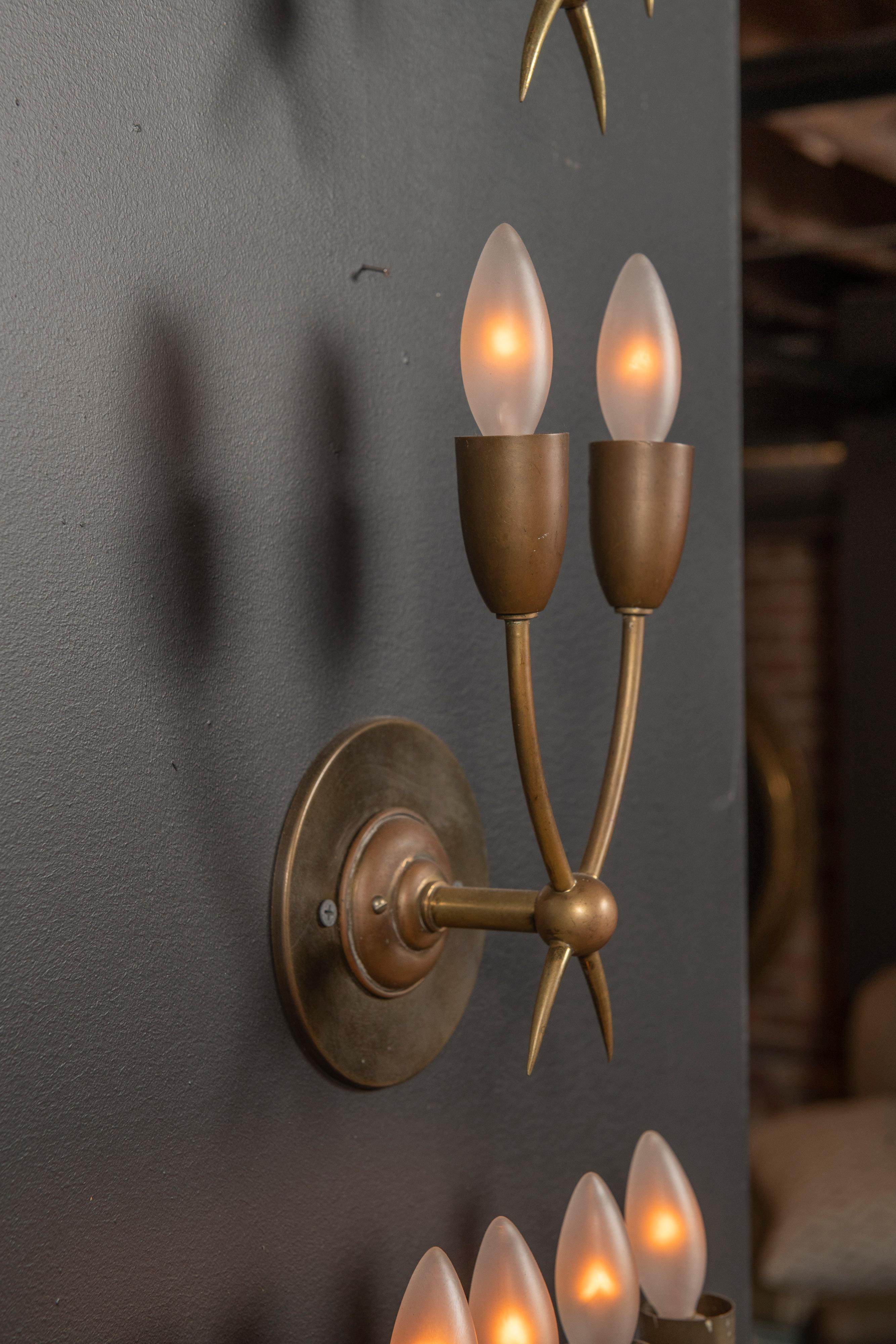 Pair of brass sconces manufactured by Guglielmo Ulrich in Italy circa late 1930s - early 1940s. Wired for US junction boxes. Each sconce takes two E14 European candelabra bulbs. 


 