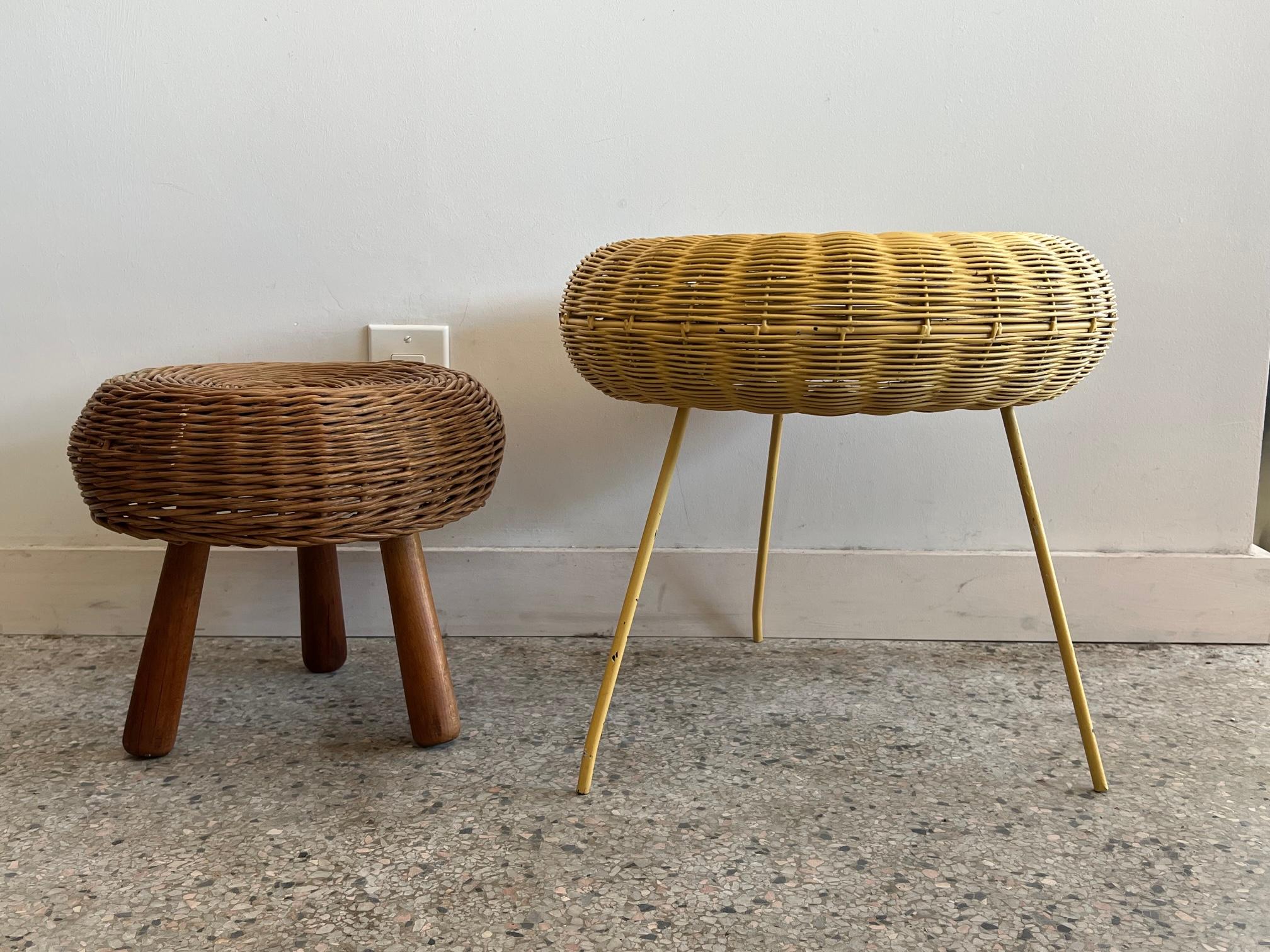 Two stools, in the style of Tony Paul, smaller with wood dowel legs and the larger with metal legs, yellow painted finish.
Larger measures 16