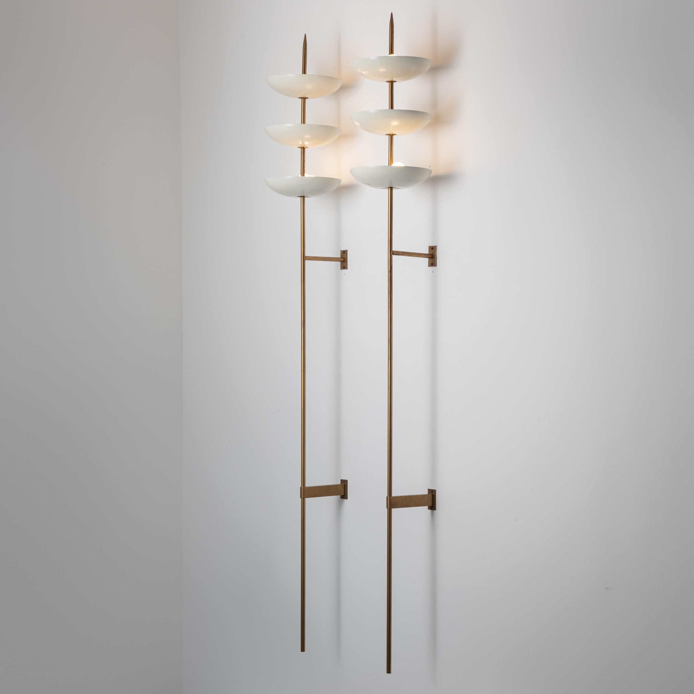 Single wall light by Stilnovo. Manufactured in Italy, circa 1950's. Painted metal, brass. Wired for U.S. standards. We recommend three E14 6ow maxim candelabra bulbs per fixture. Bulbs not included. Priced and sold individually, not as a pair.
QTY: