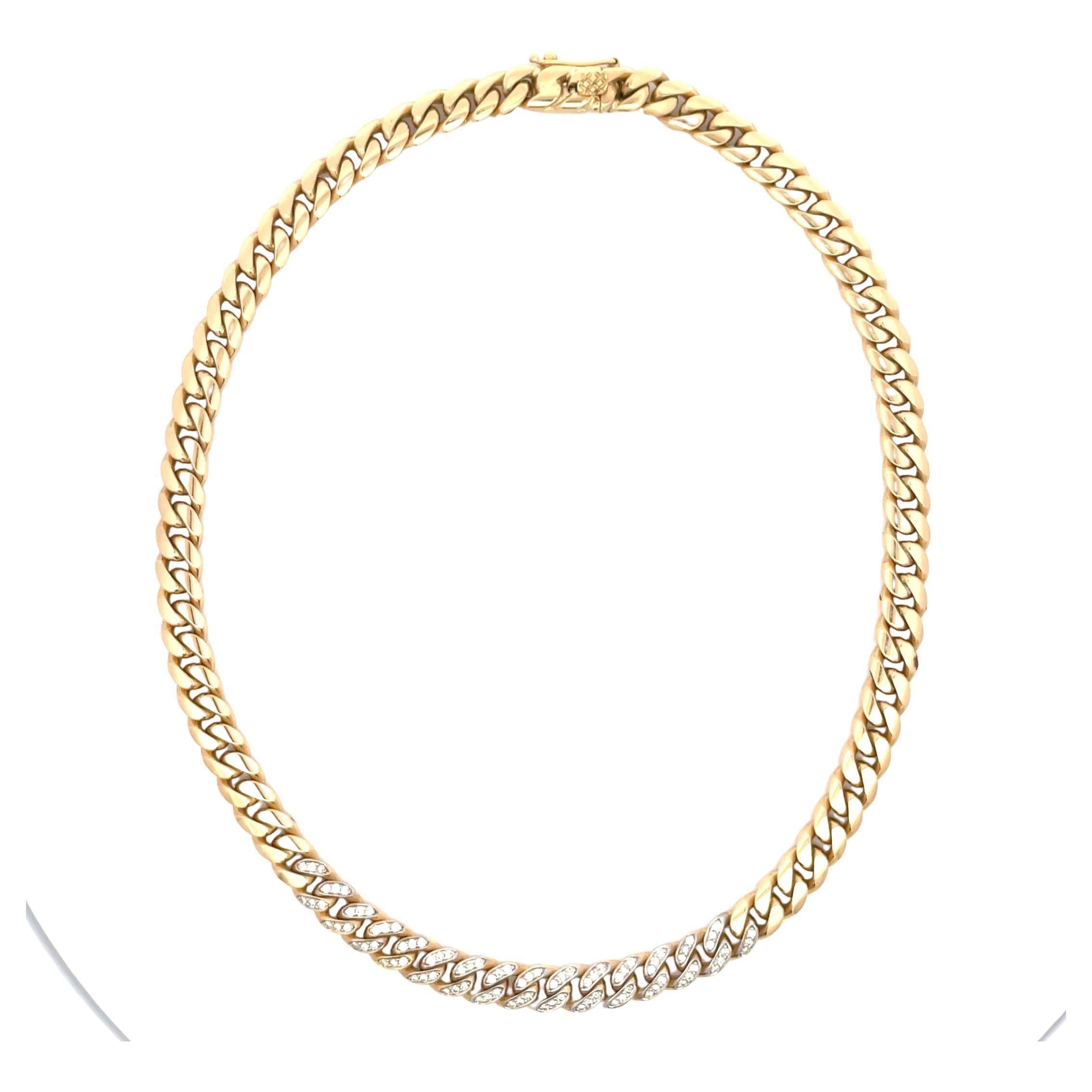 18 Karat yellow gold choker chain featuring a Cuban motif design and 15 diamond links weighing approximately 1 carat. 75.4 Grams
Can be worn two ways - diamonds showing or plain gold 