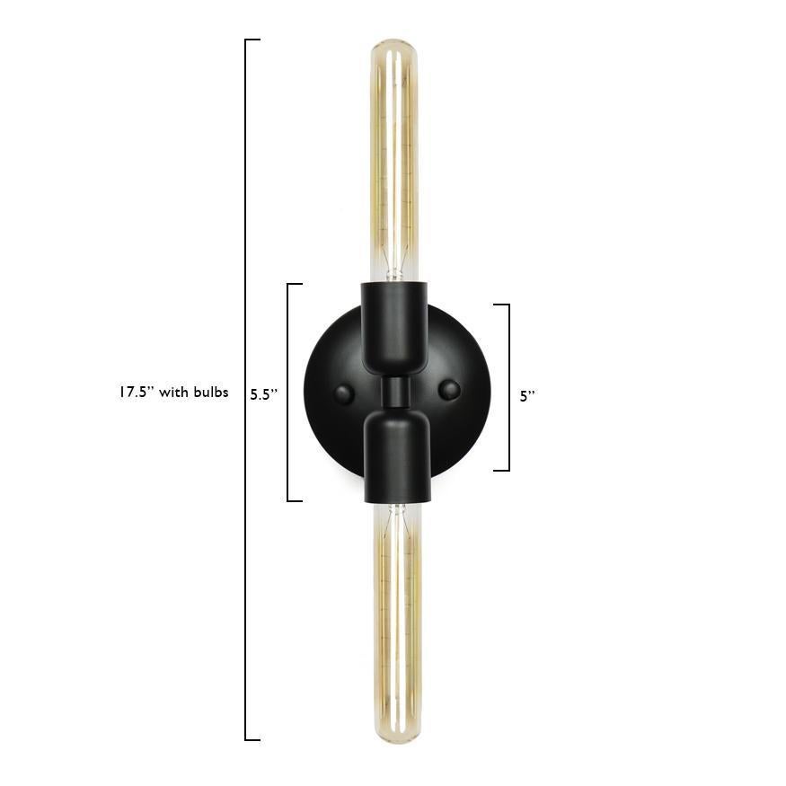 A simple modern sconce to accent your bedroom, bathroom, or work space. This contemporary light also works well in a commercial setting restaurant, retail, or office space. Can be mounted in any direction.
Designed by Michele Varian
Matte black