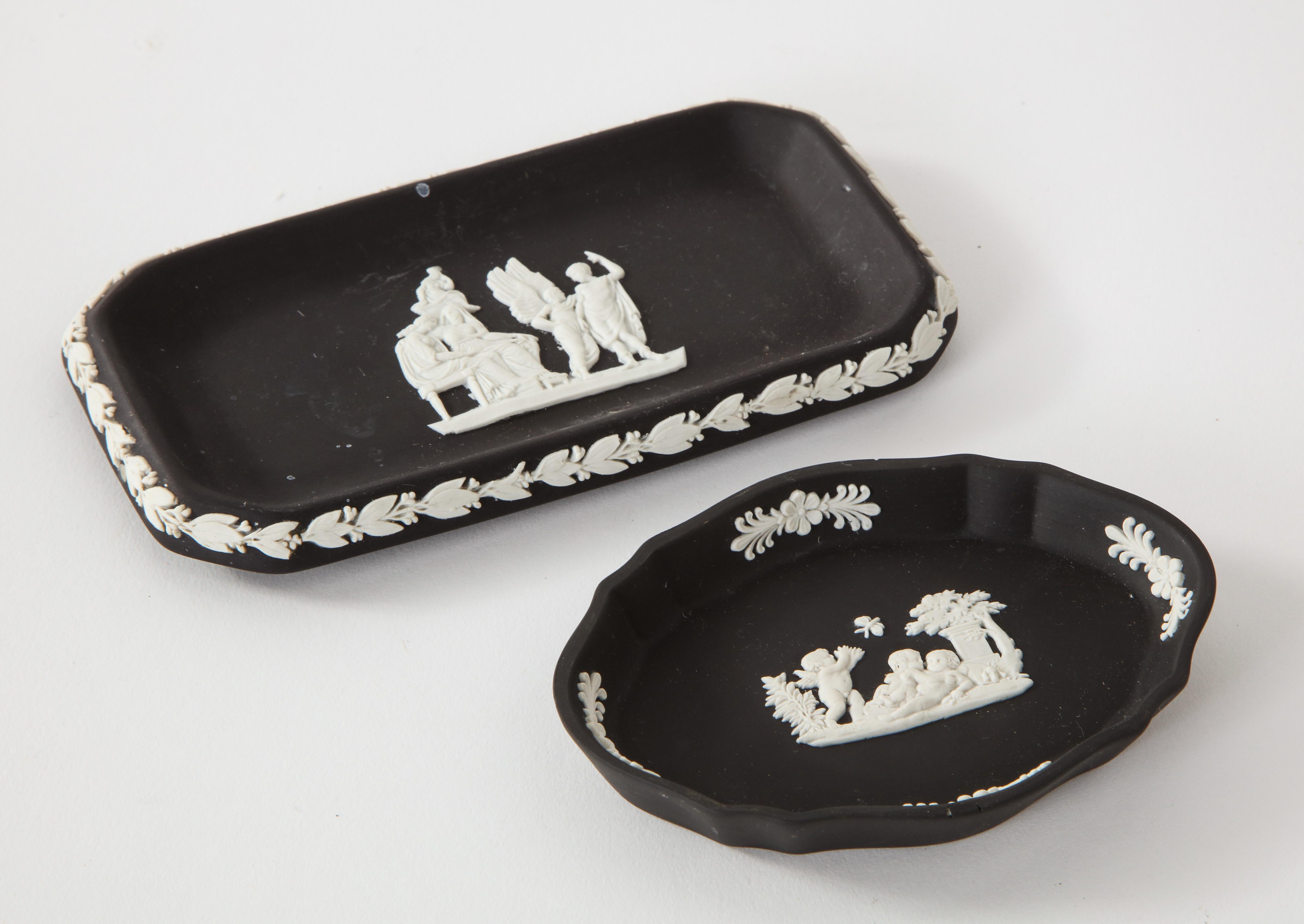 Two black and white antique basalt Wedgwood Jasperware trays. 

Measures: Rectangular: 5.75