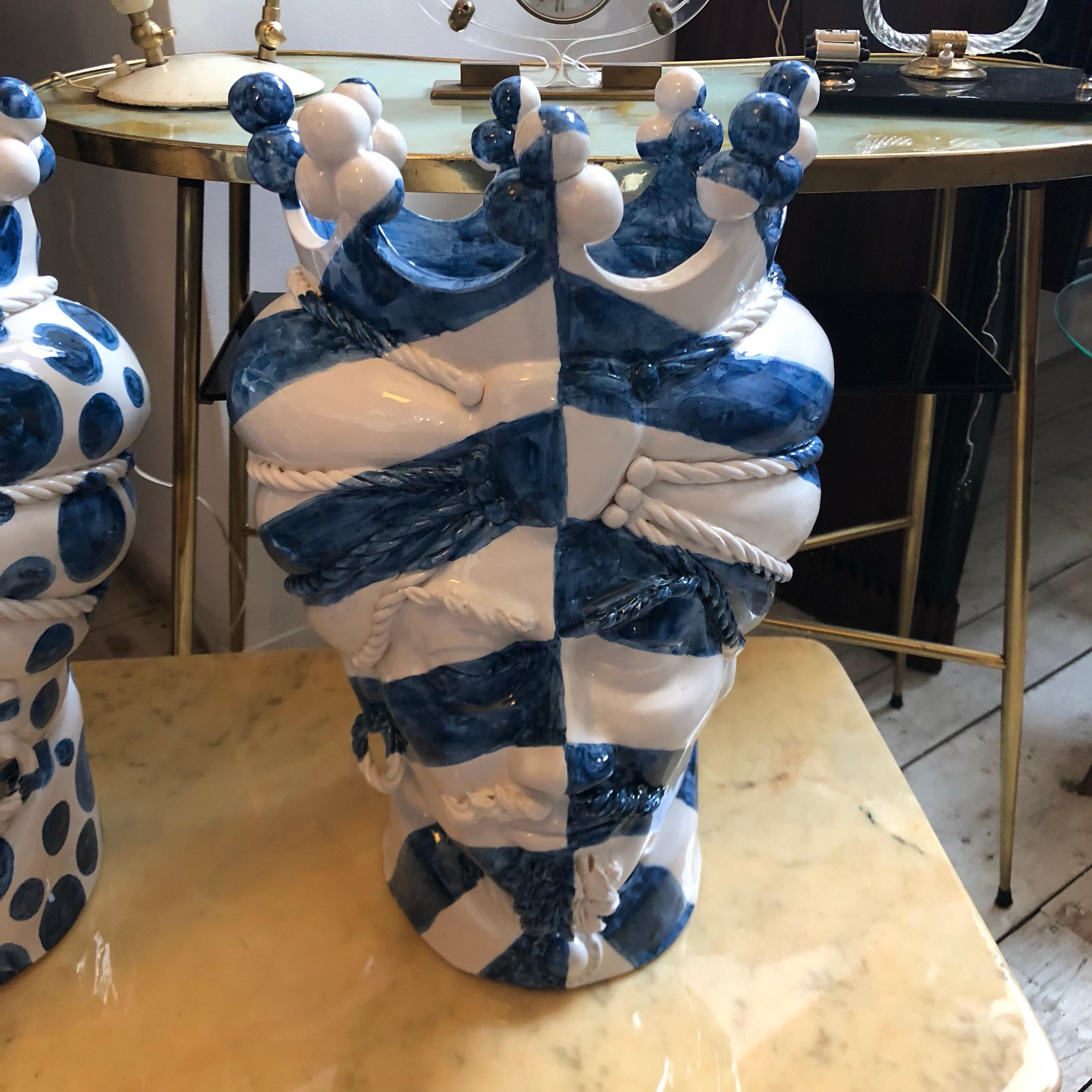 It's an amazing pair of white clay Sicilian Moro's head vases, interpreted in a modern style by a sicilian painter and signed 1/1 MR on the base. There are no copies of these, they are uniques pieces. The legend of the Sicilian Moro's heads speaks