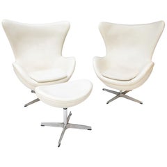 Retro Two White Leather Egg Chairs and Footstool