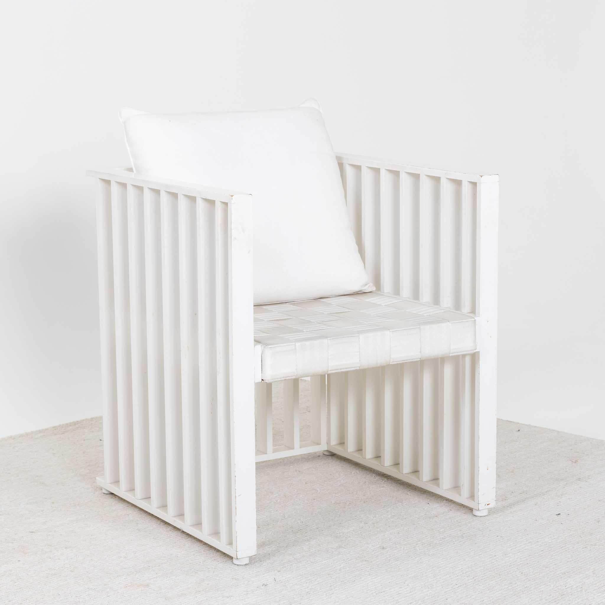 Pair of armchairs originally designed by Josef Hoffmann in 1903 for the Purkersdorf Sanatorium in Vienna. The geometric concept of the armchairs, consisting of white lacquered vertical struts, exemplifies the innovative power of the Vienna Secession