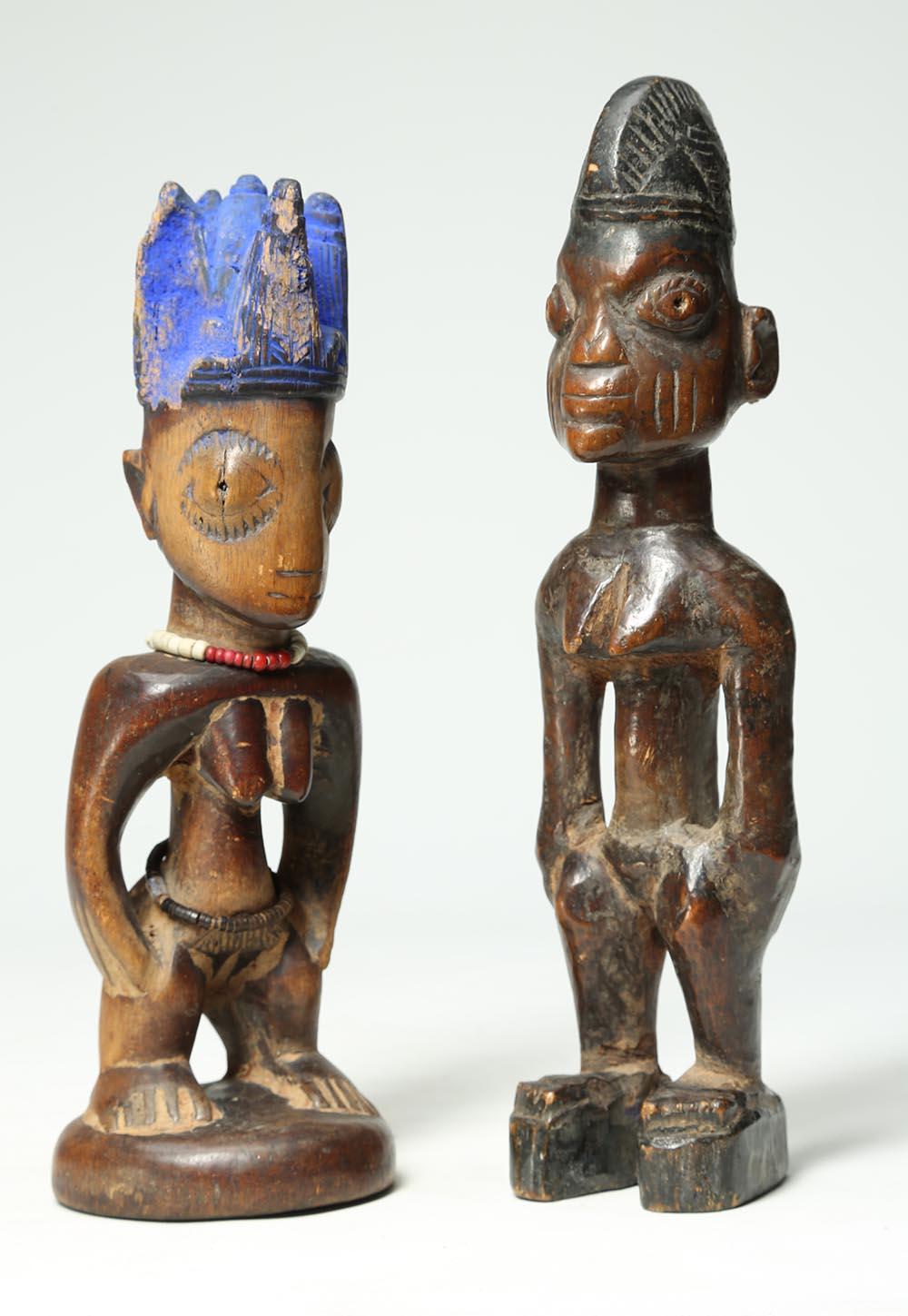 Two very well loved and worn carved wood Yoruba twin figures 