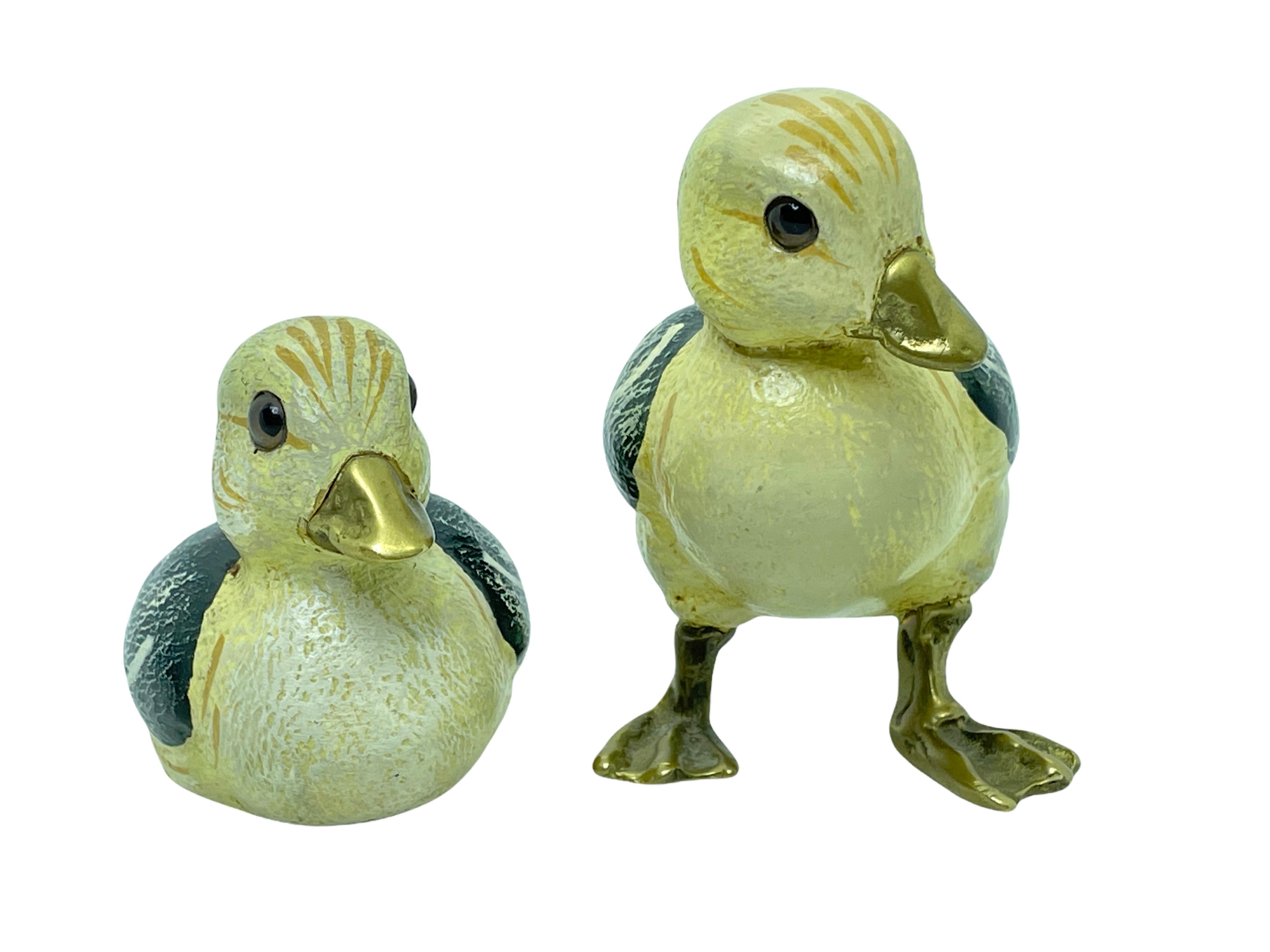 Vintage signed duck figurine by Malevolti, Italy. It features a decoy type design with brass accented parts. It has glass eyes and a hand painted body. A nice addition to the Hollywood Regency interior. Signed Malevolti Italy. Tallest approx. 3 1/4