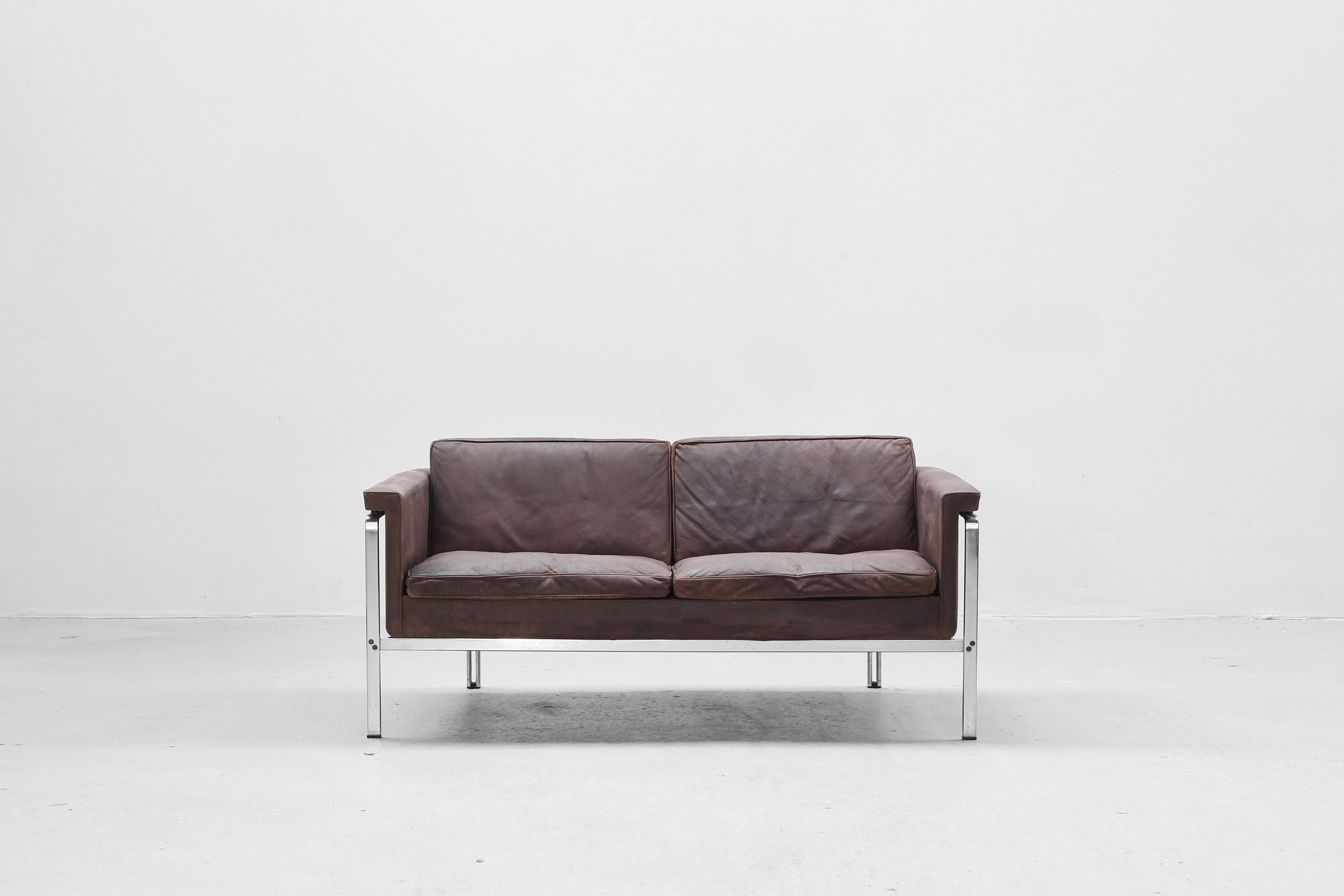 Beautiful two-seat sofa designed by Prof. Horst Brüning and manufactured by Alfred Kill International, Germany 1968. This sofa comes in a patinated dark brown leather in a good condition with little traces of usage.

We have two sofas of this