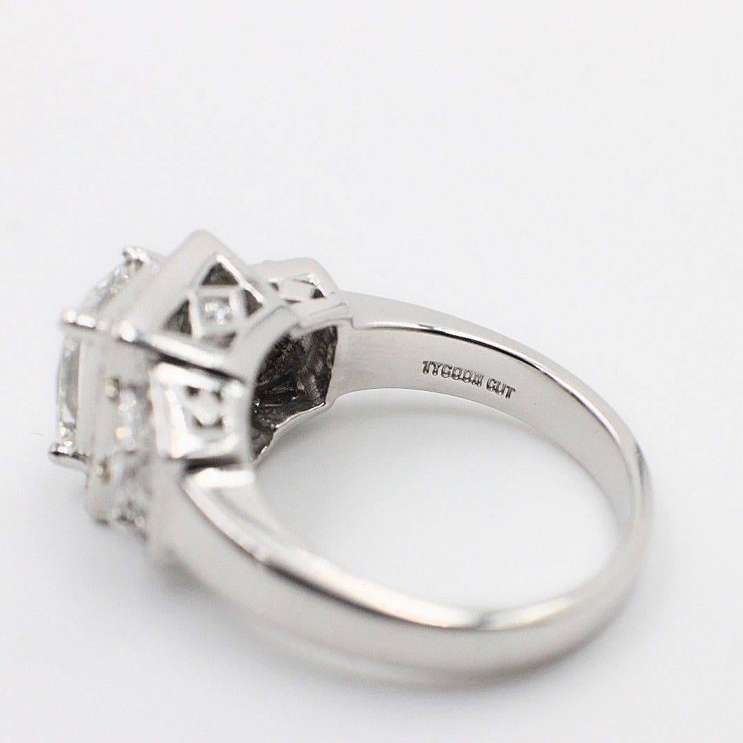 Tycoon Cut 2.42 Carat Three-Stone Halo Design Diamond and Platinum Ring In Excellent Condition For Sale In San Diego, CA