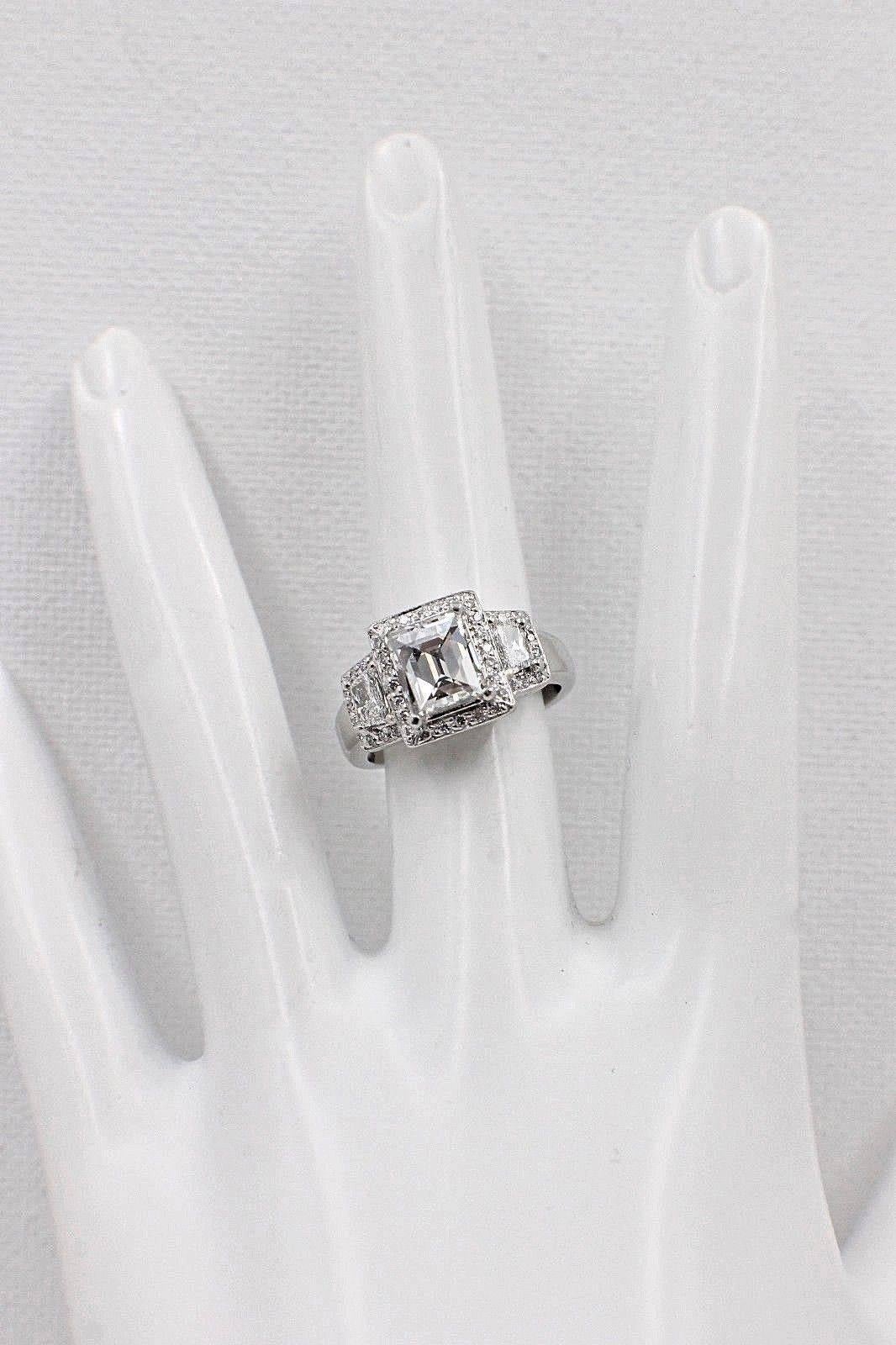 Women's Tycoon Cut 2.42 Carat Three-Stone Halo Design Diamond and Platinum Ring For Sale