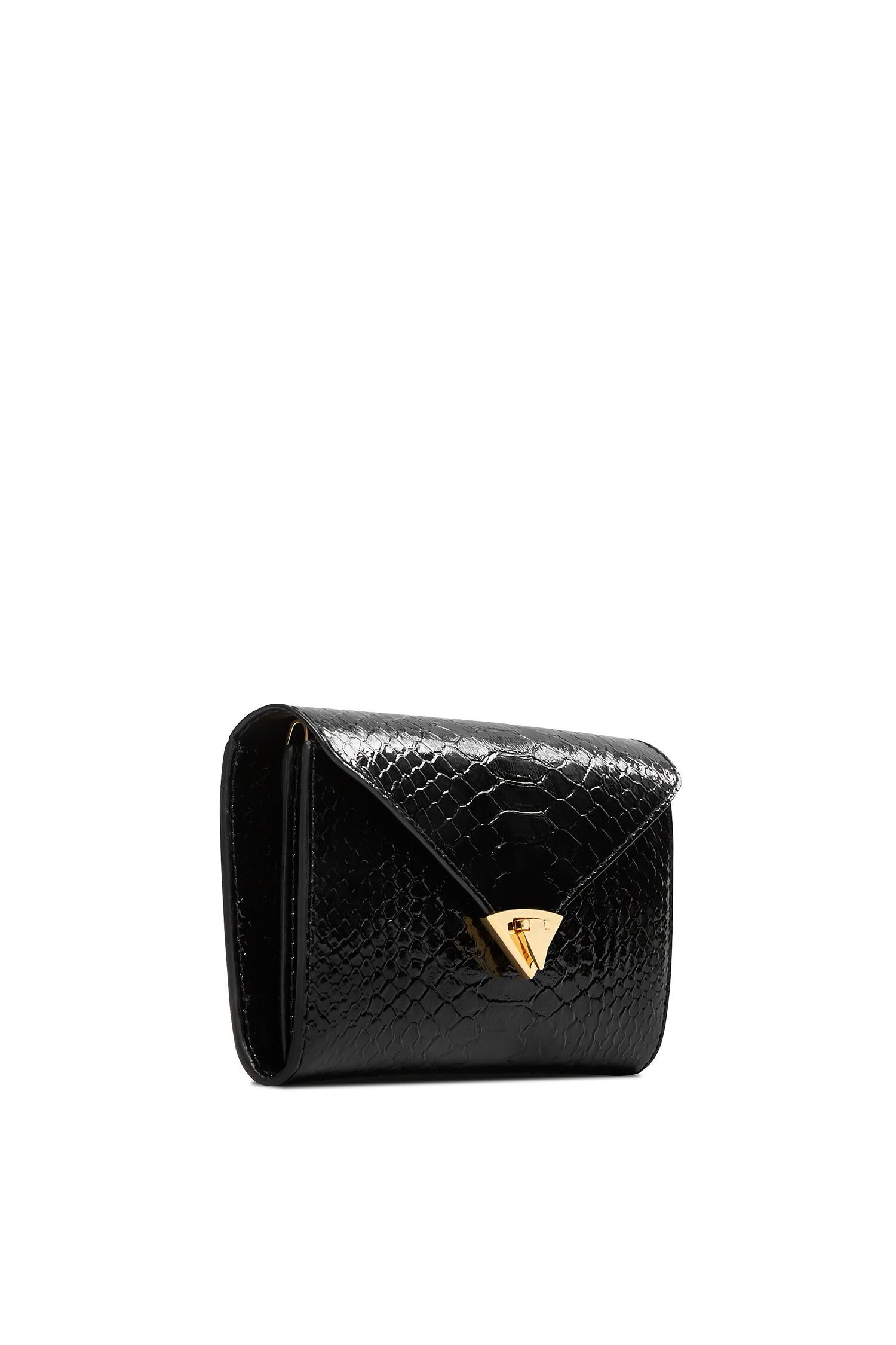 The Alex Wallet Noir Glossy Python Gold Hardware is designed with a detachable gold cross-body chain, interior credit card slots and a pinecone pull zip pocket. It features our signature spear-lock closure and Thayer blue leather lining.

Size: One