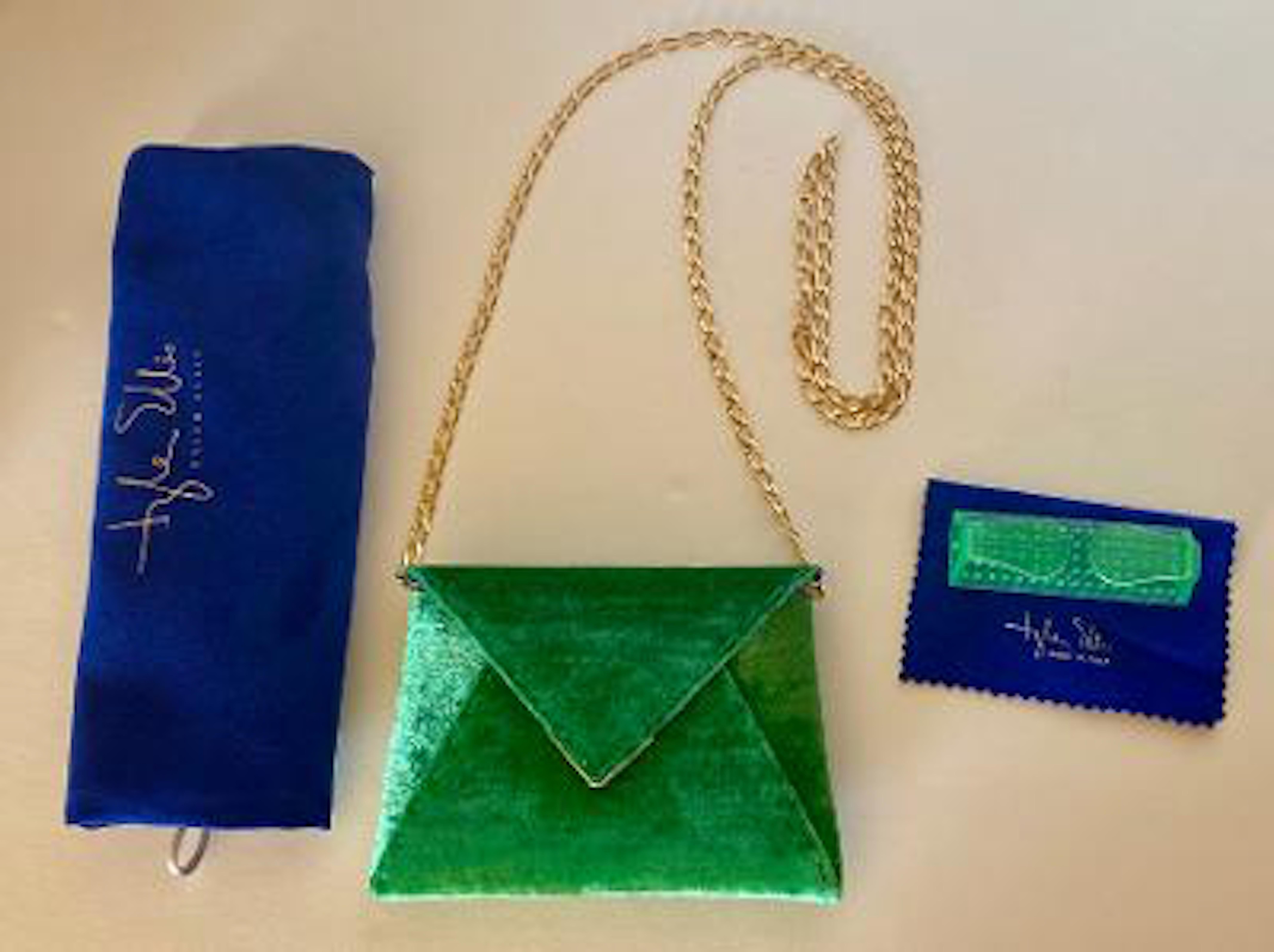 Fabulous couture designer, Tyler Ellis, custom hand made crushed velvet shamrock or emerald green envelope shaped Lee Pouchet clutch with a triangular front flap and a magnetic closure.  There is a hidden exterior pocket on the back.  Perfect to use