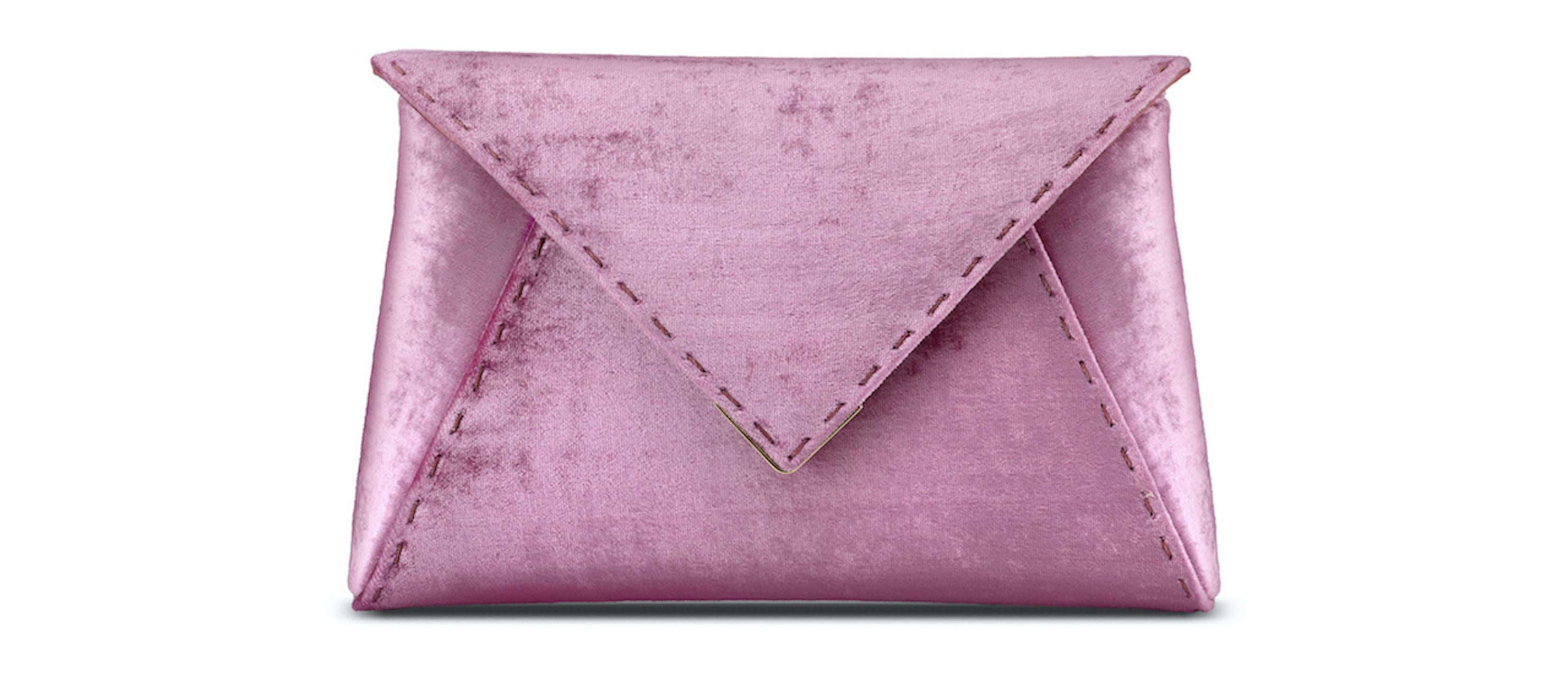 The Lee Pouchet Small is featured in our Metallic Rose crushed velvet with rose gold hardware. The envelope-shaped clutch is designed with a triangular front flap and a magnetic snap closure. The Lee fits the large iPhone, has a hidden exterior