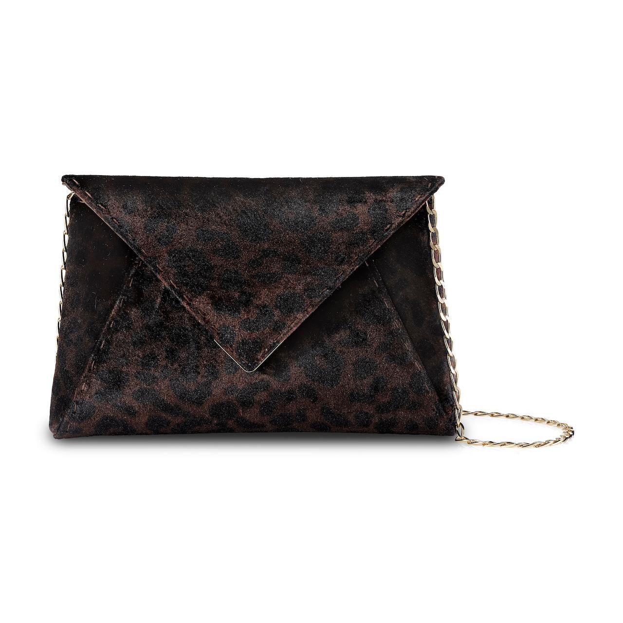 The Lee Pouchet Small is featured in our Leopard Animal Print crushed velvet with gold hardware. The envelope-shaped clutch is designed with a triangular front flap and a magnetic snap closure. The Lee fits the large iPhone, has a hidden exterior