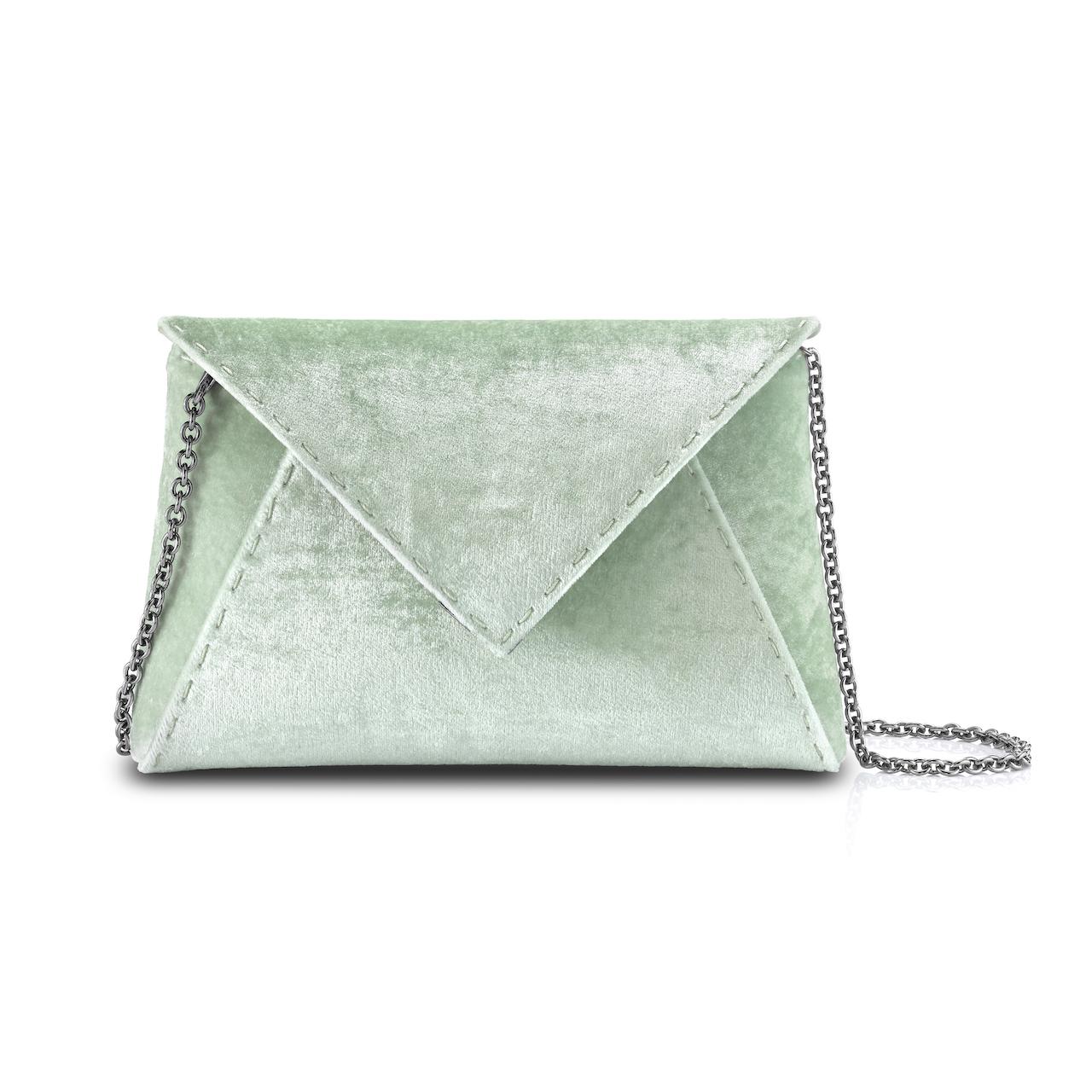 The Lee Pouchet Small is featured in our Pistachio crushed velvet with gunmetal hardware. The envelope-shaped clutch is designed with a triangular front flap and a magnetic snap closure. The Lee fits the large iPhone, has a hidden exterior pocket,