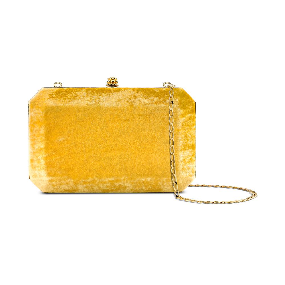 The Lily is featured in our Golden Honey crushed velvet with gold hardware. It is a hard-framed rectangular clutch designed with interior pockets and an optional gold cross-body chain. It fits the large iPhone and features our signature Pinecone