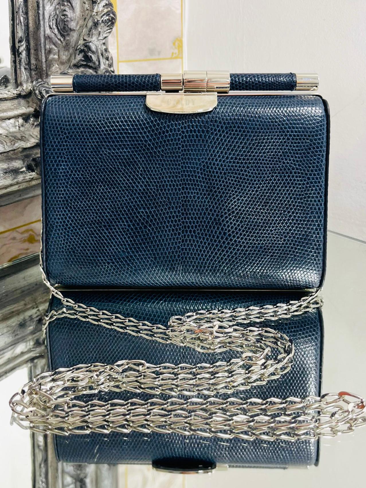 Tyler Ellis Lizard Skin Clutch Bag With Chain Strap

Dark grey, structured 'Jamie' evening bag in exotic leather.

Detailed with silver hardware which has been personalised with 'Candy' lettering.

Featuring detachable shoulder chain strap and