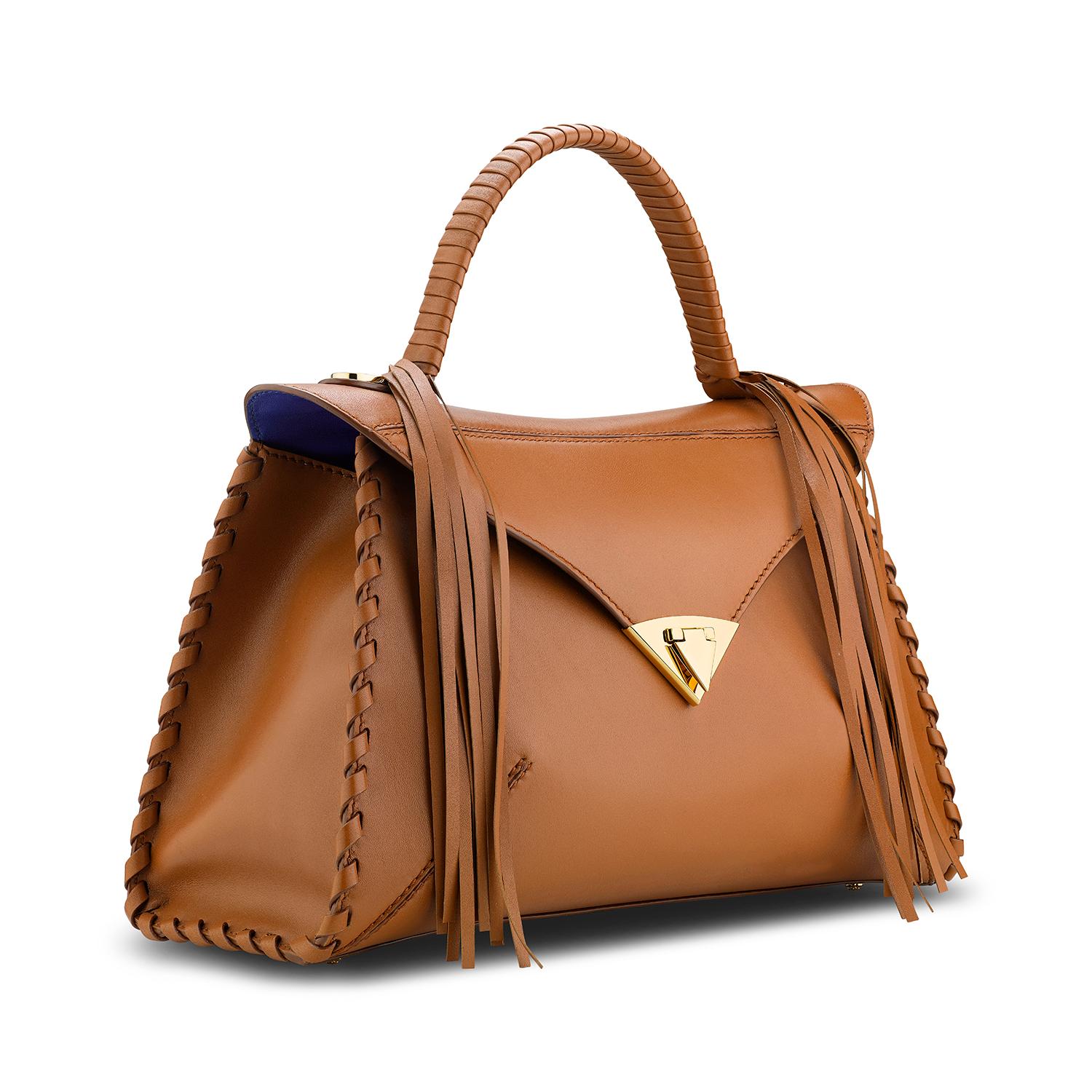 **Made to Order**

The LJ in Cognac Leather Gold Hardware is a semi-structured handbag with a triangular front-flap and our custom spear-lock closure. It is designed with a top-handle, handmade whipstitch detail and an optional chain. It has a