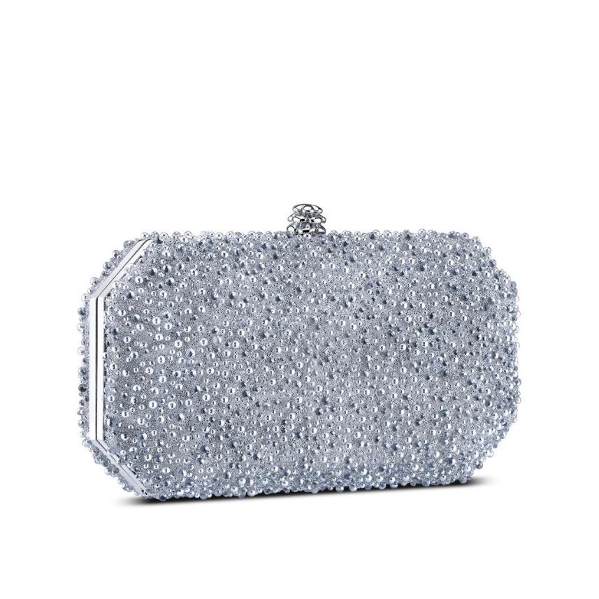 The Perry Clutch in Silver Bubble Swarovski Crystal is a hard-framed clutch designed with interior pockets and an optional gold cross-body chain. Its elegant emerald shape is inspired by Tyler’s own engagement ring and named after her father, Perry