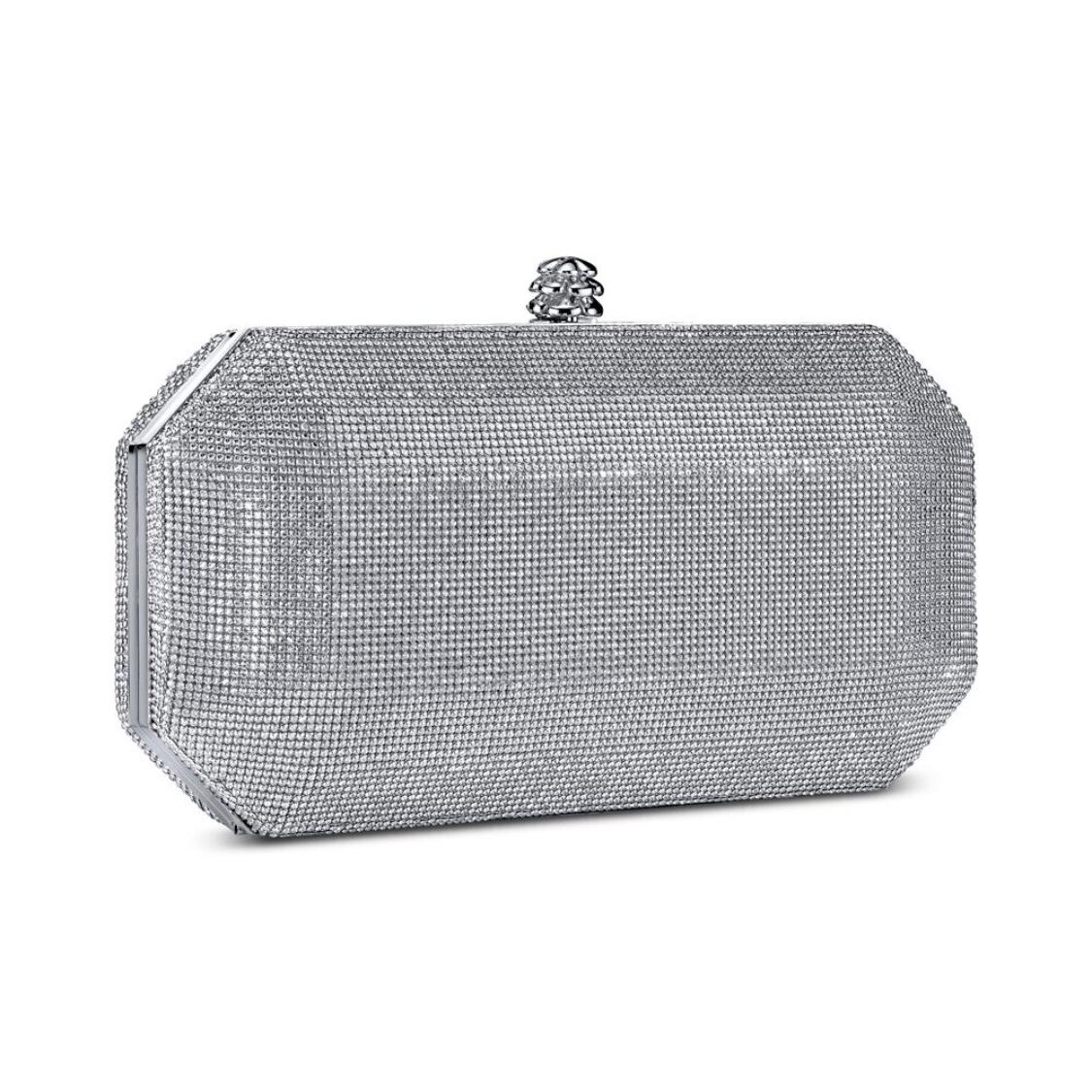 The Perry Clutch Small in Silver Swarovski Crystal Fine Mesh is a hard-framed clutch designed with interior pockets and an optional gold cross-body chain. Its elegant emerald shape is inspired by Tyler’s own engagement ring and named after her