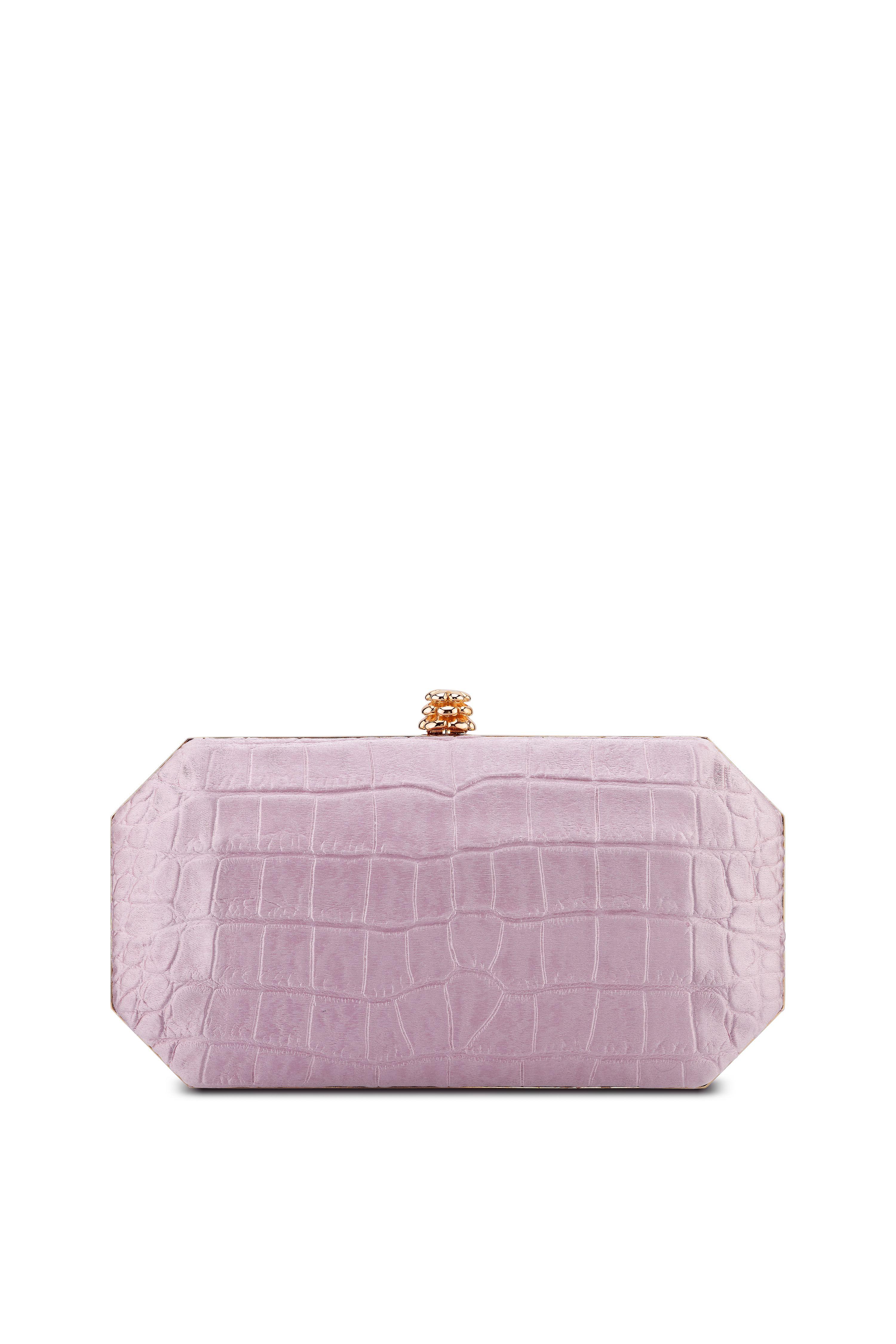 The Perry Small is featured in our Antique Pink stamped satin with rose gold hardware. The Perry is a hard-framed clutch designed with interior pockets and an optional rose gold cross-body chain. It's elegant emerald shape is inspired by Tyler's own