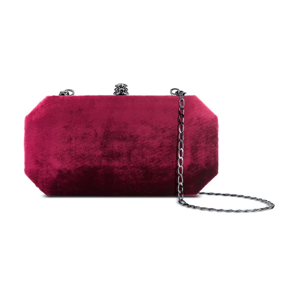 The Perry Small is featured in our Deep Garnet crushed velvet with gunmetal hardware. The Perry is a hard-framed clutch designed with interior pockets and an optional gunmetal cross-body chain. It's elegant emerald shape is inspired by Tyler's own