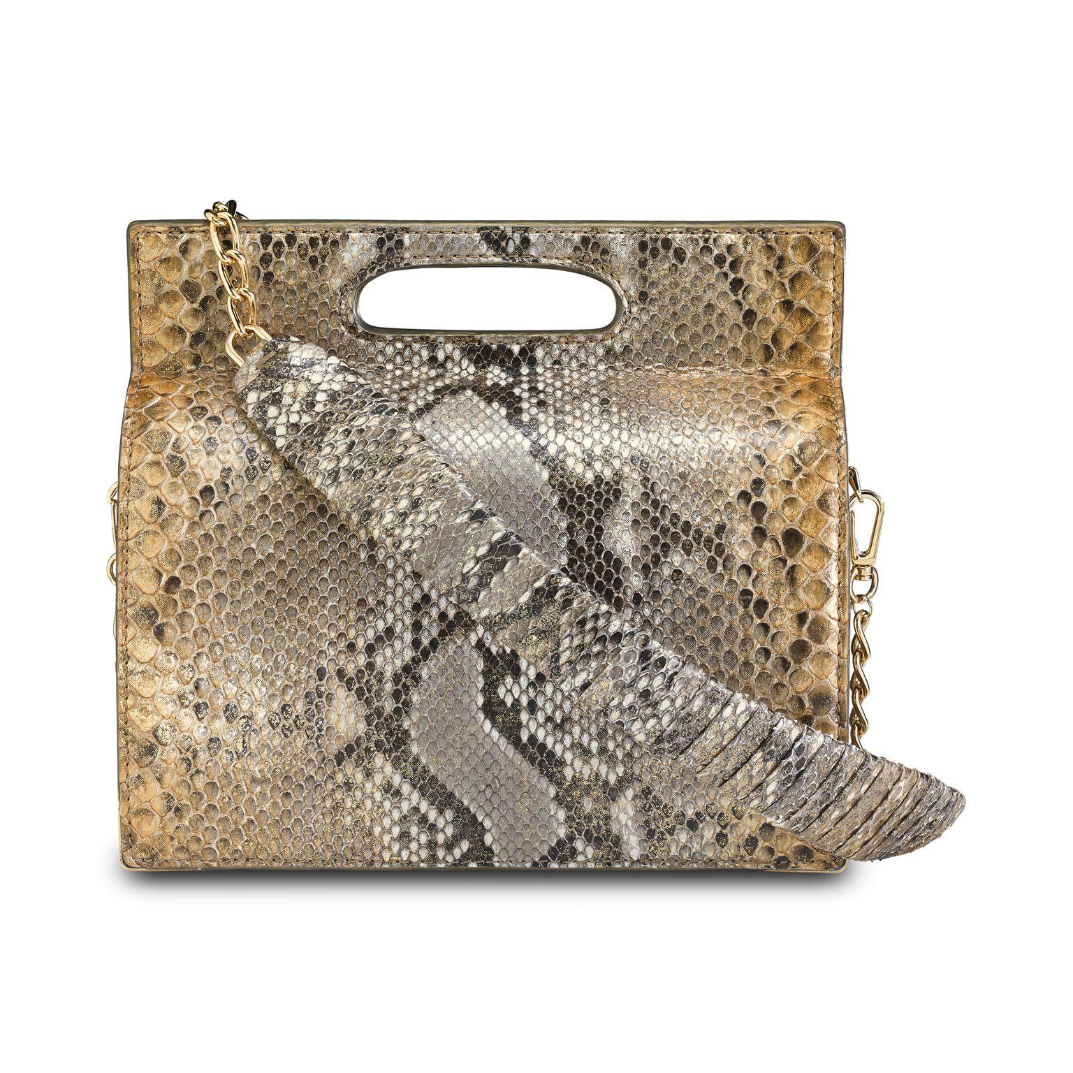 The Stella Handbag Tall is featured in Metallic Gold Natural Python with gold hardware. The structured handbag has a magnetic closure and an optional cross-body chain with a python-wrapped accent. It fits the large iPhone, has custom exterior metal