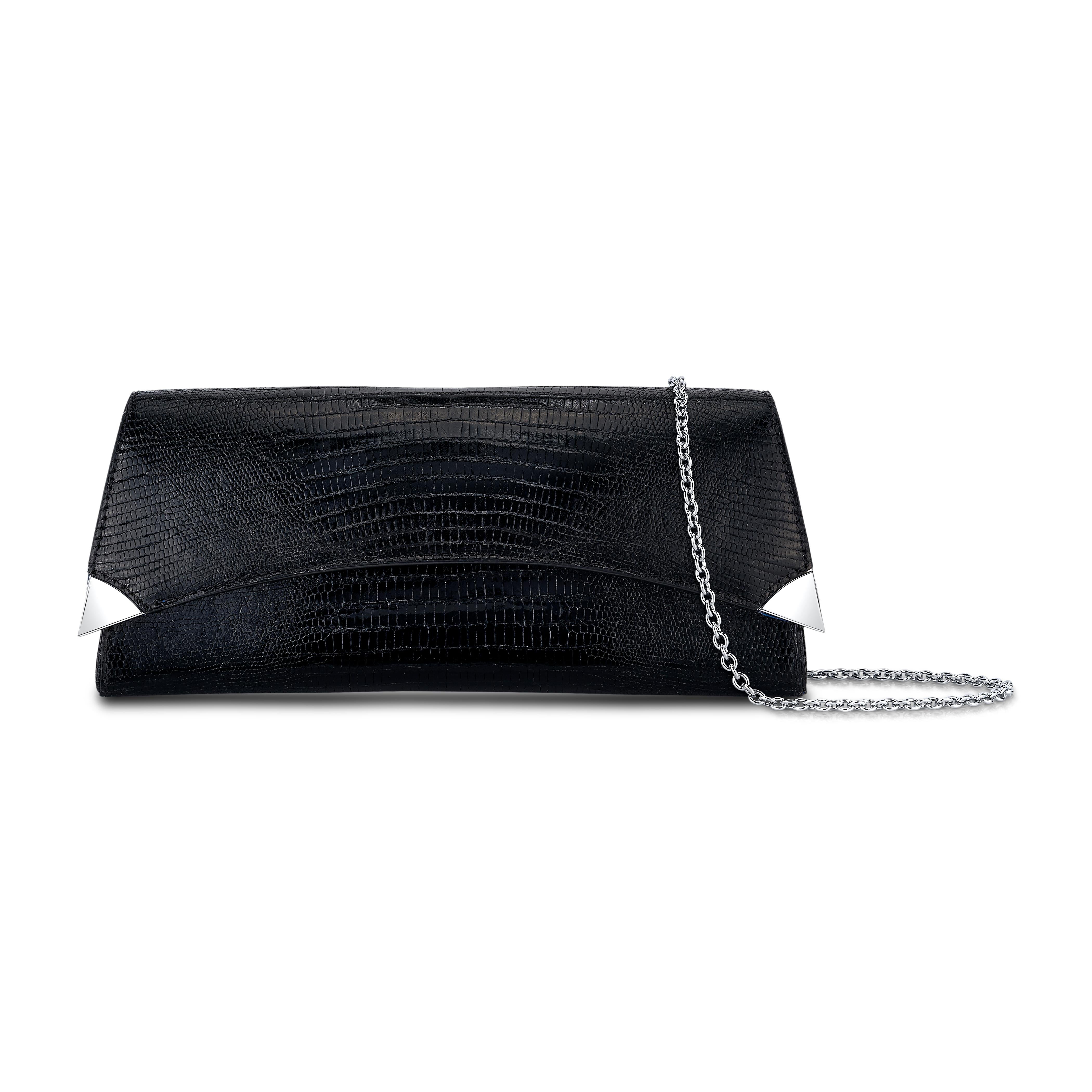 The Veronica in Black Glitter Lizard is designed with a three-quarter front flap and a magnetic snap closure. The clutch features a rounded back providing an extra spacious interior. It fits the large iPhone has a hidden back pocket, customized