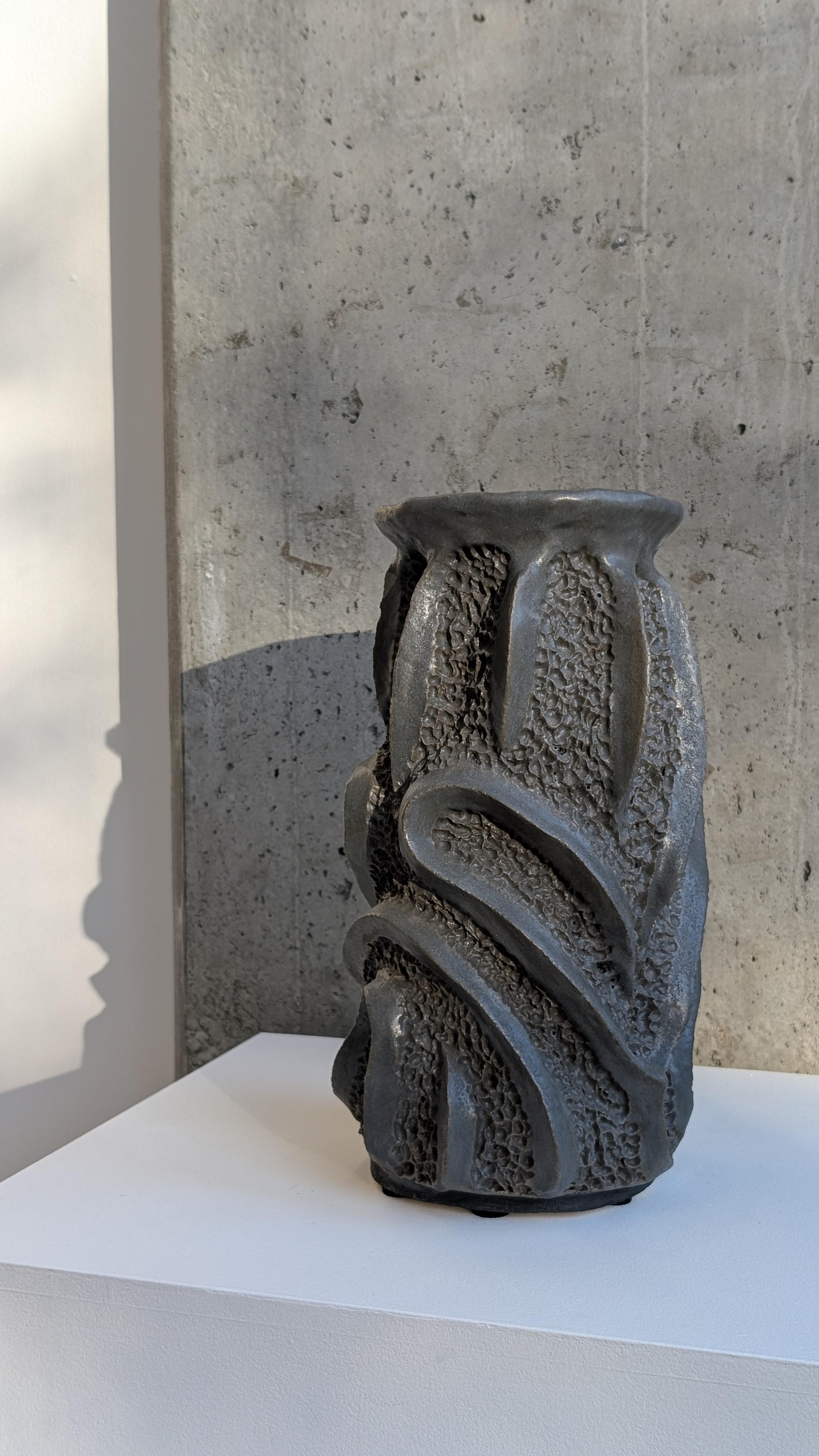 Tyler James Goin is a Vancouver-based sculptor whose work bridges the industrial and the organic through clay and metal. With a background as a millwright machinist and a decade-long apprenticeship with sculptor Tony Bloom, Goin brings technical