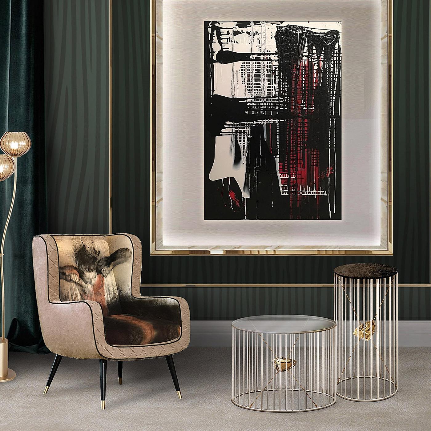 A splendid piece to pair with the Tyler Tall Side Table, this piece will add an accent of plush sophistication to both a private studio or living room. Made of nickel-finished brass, the structure features a ring-shaped based sustaining a
