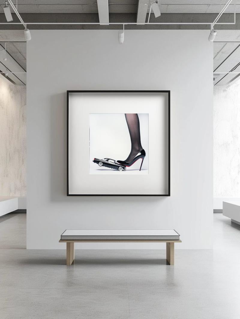 Chrysler Heel - Heel crushing a Car, Fine Art Photography - Gray Color Photograph by Tyler Shields