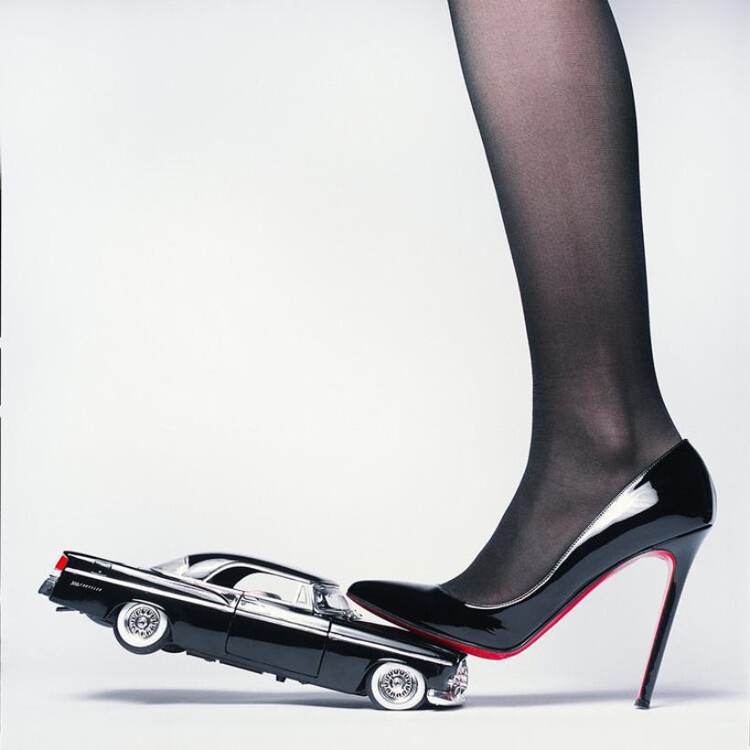 Tyler Shields Color Photograph - Chrysler Heel - Heel crushing a Car, Fine Art Photography