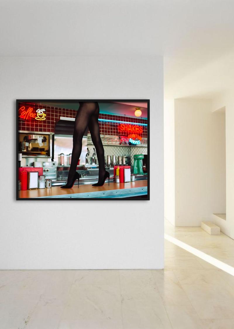 Diner High Heels, woman walking on a counter in Louboutins  photographed by Tyler Shields.

All prints are limited edition. Available in multiple sizes. High-end framing on request.

All prints are done and signed by the artist. The collector
